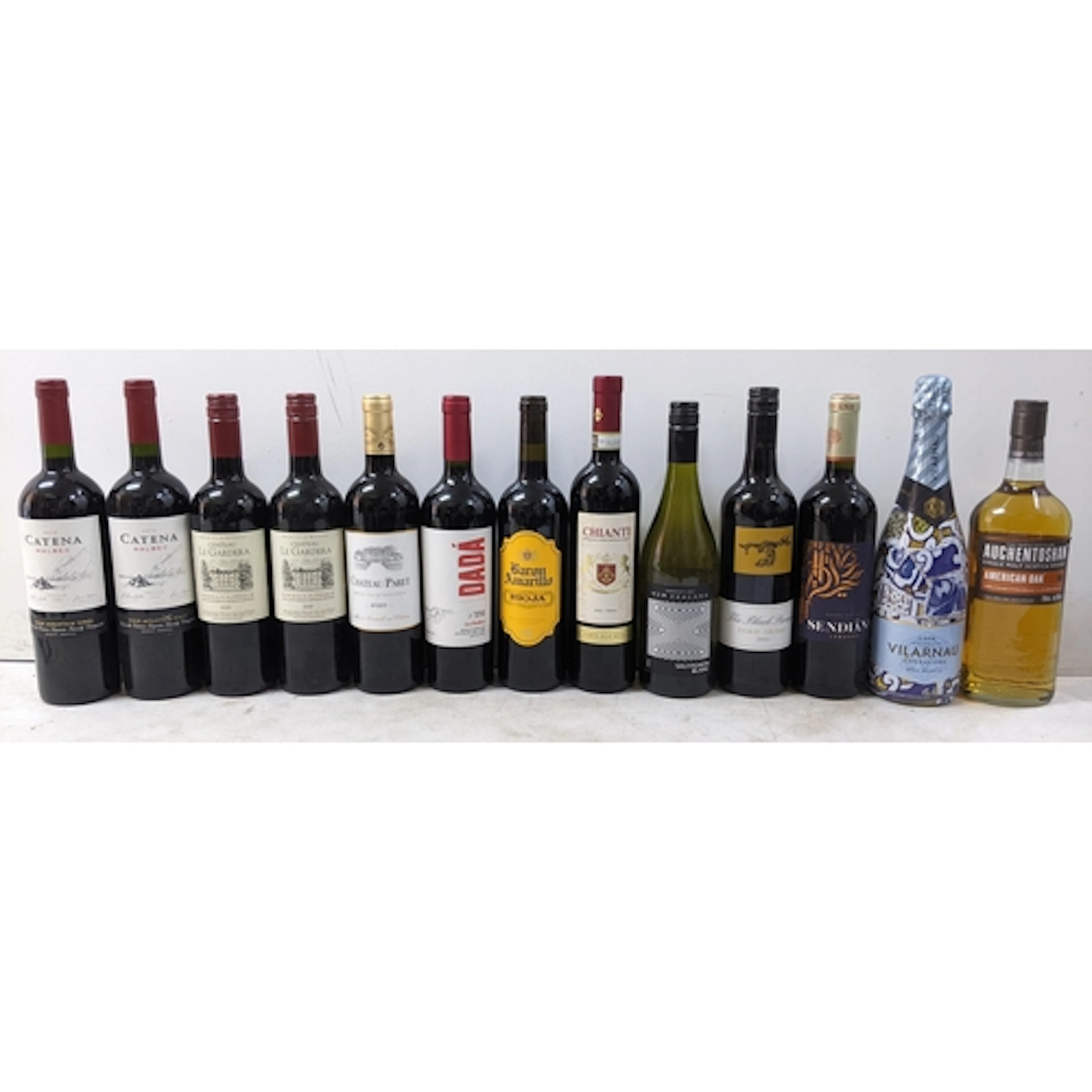 A mixed group of thirteen bottles of wine and spirits, compr...