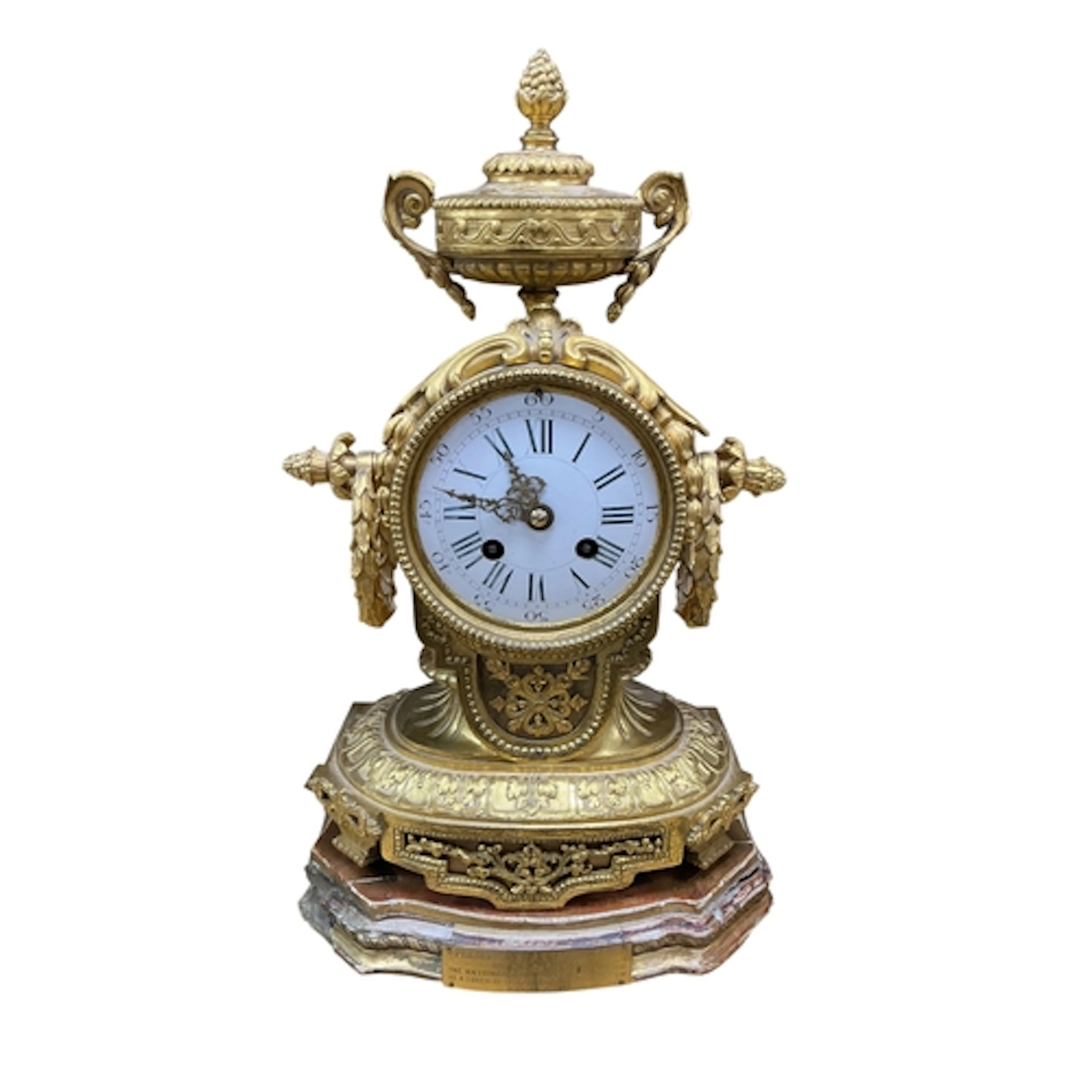 A 19th century French ormolu mantel clock, with urn surmount...