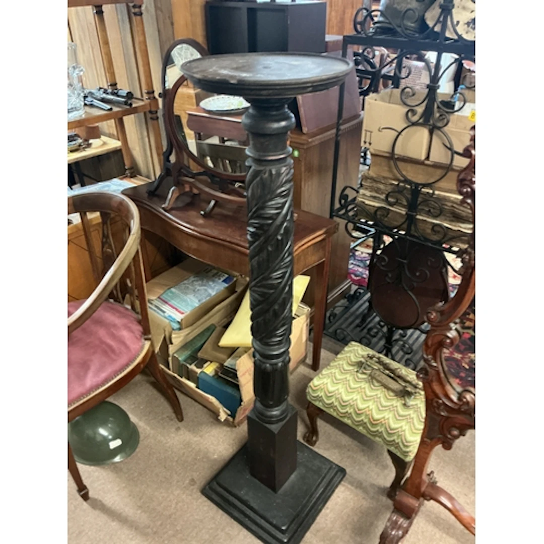 Victorian ebonized torchère with carved design. 135cm...