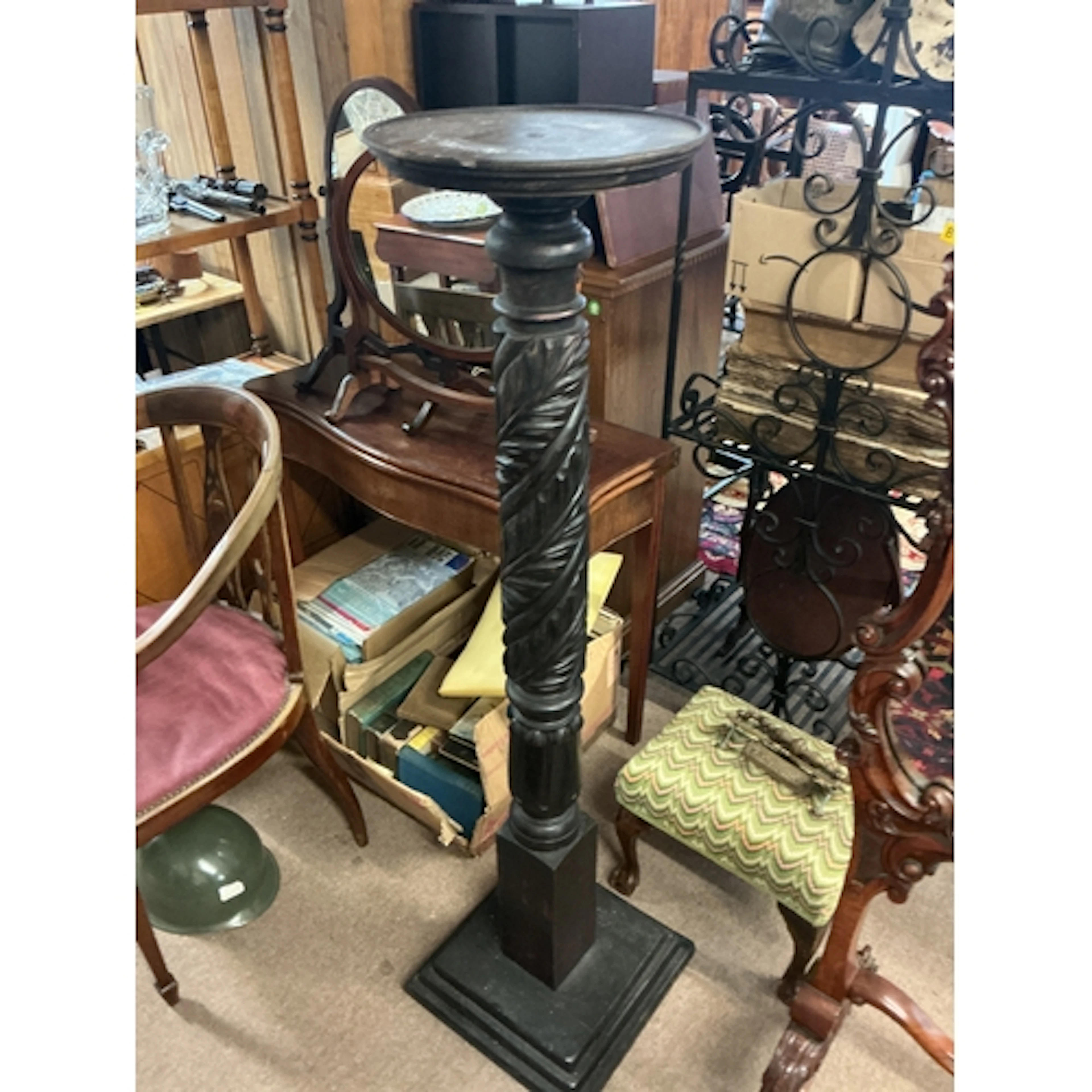 Victorian ebonized torchère with carved design. 135cm...