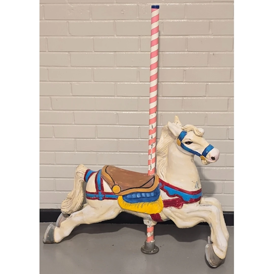 A vintage metal painted merry-go-round horse with pole. Pole...