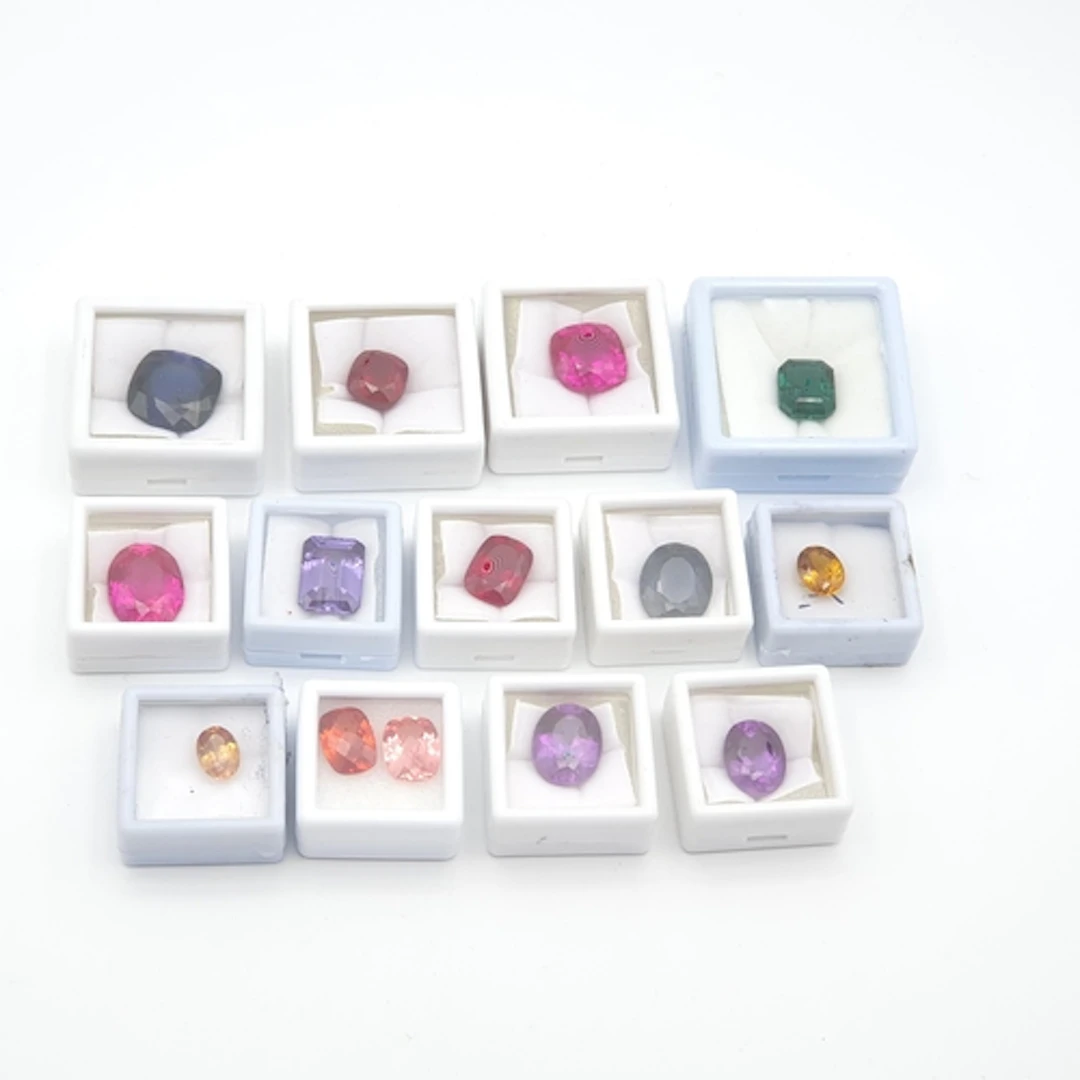 A collection of large synthetic loose Gemstones including sa...