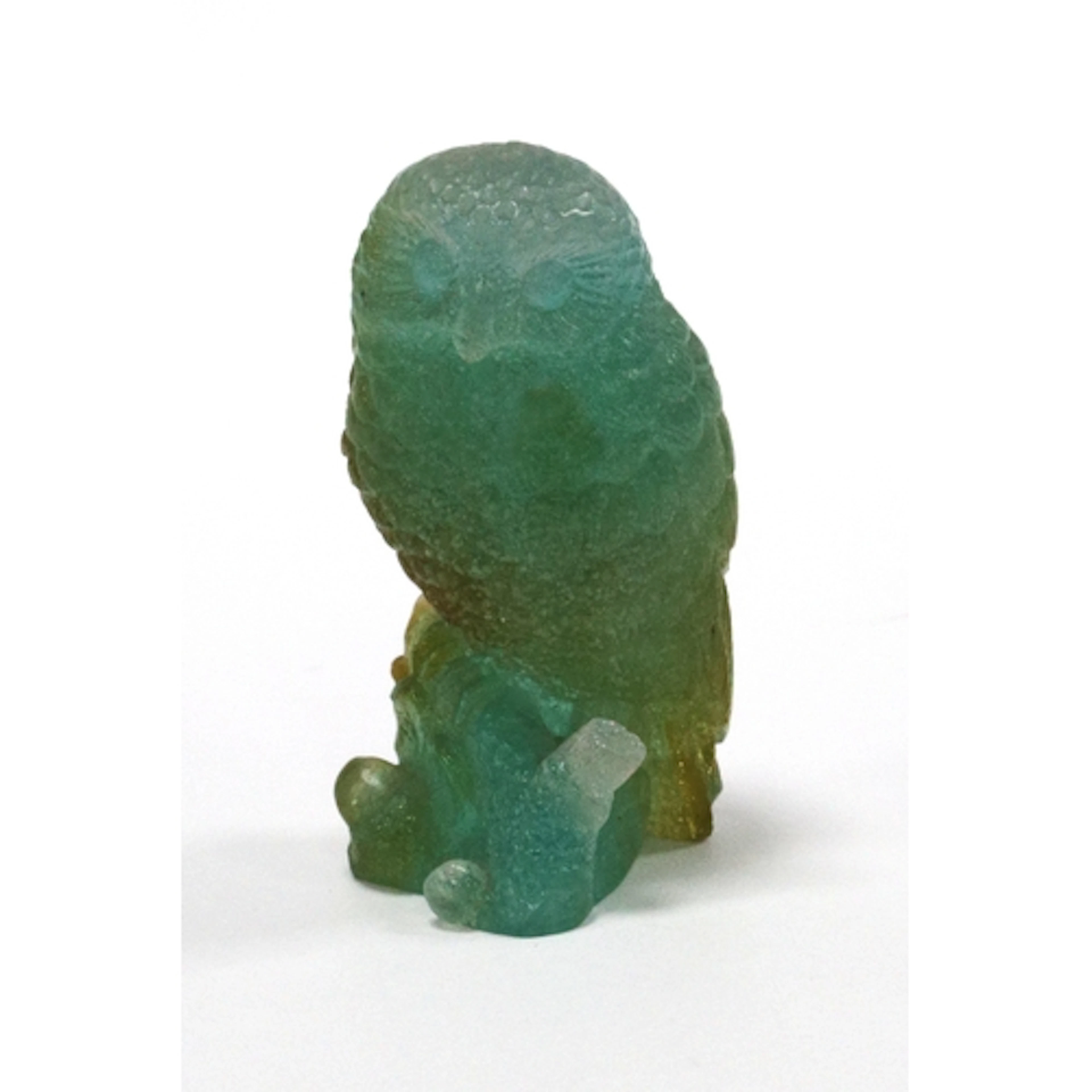 A Daum Model of an Owl Perched on a Branch, in frosted green...