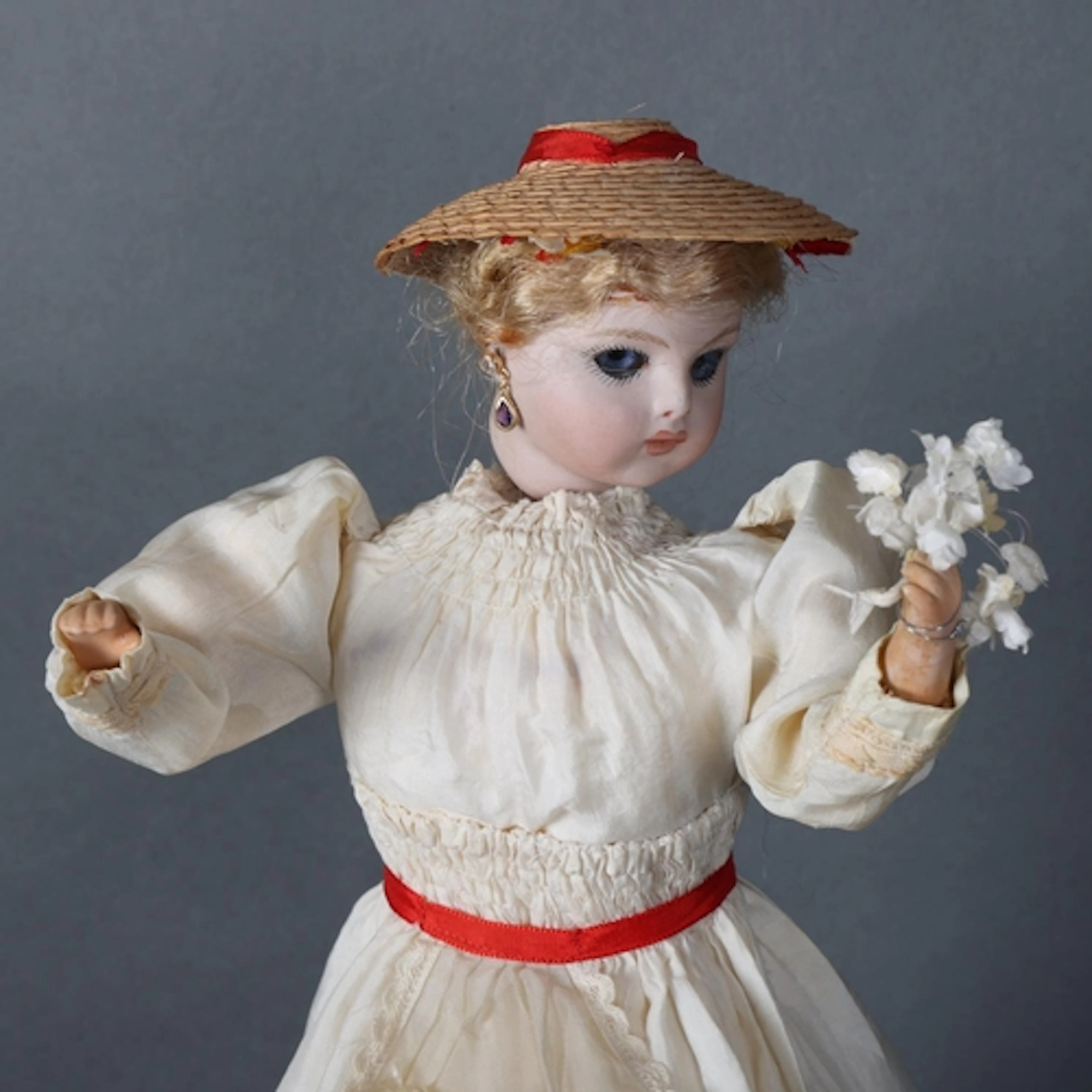 A Bru Jne bisque-headed automaton flower seller doll, clockw...