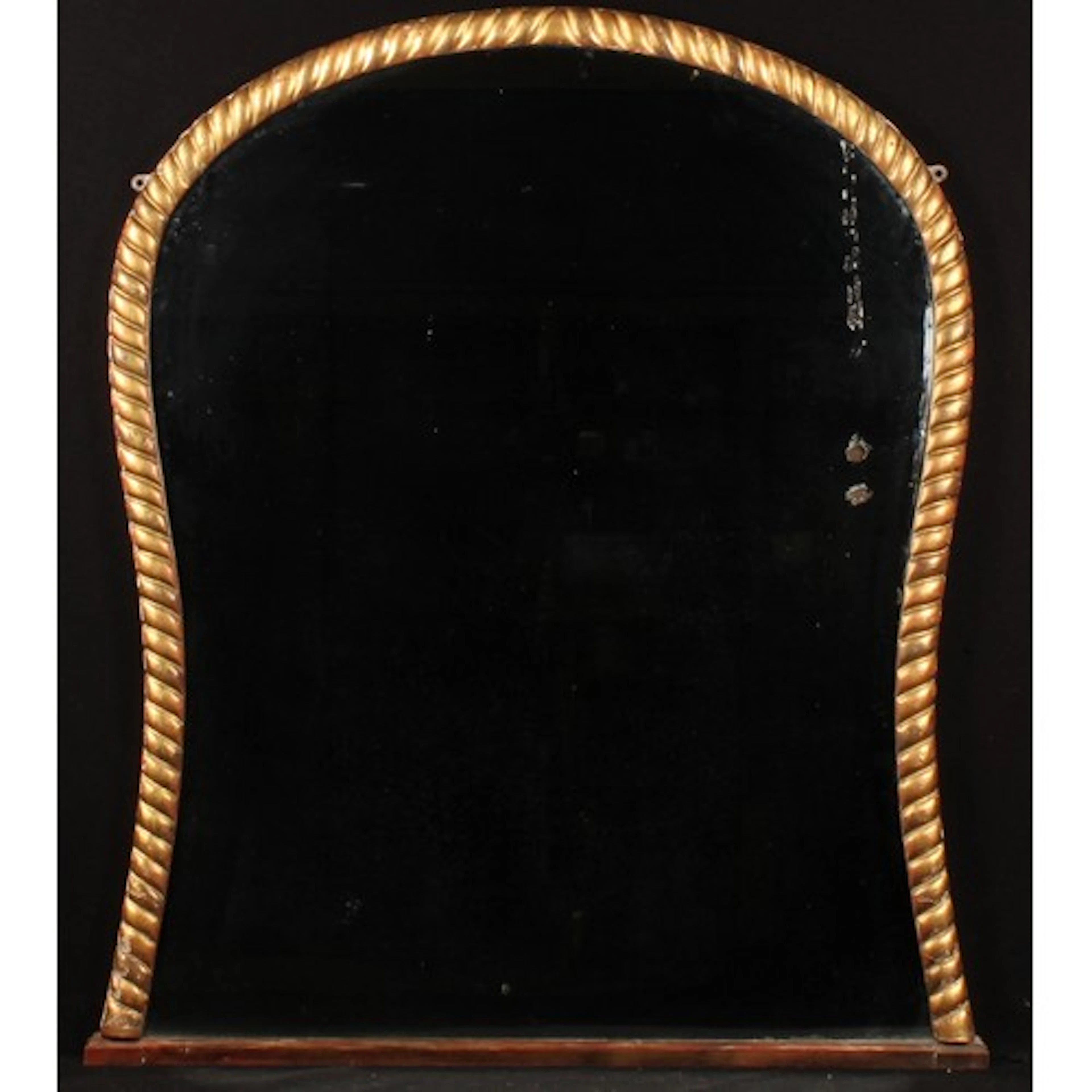 A 19th century giltwood chimney glass, waisted arched mirror...