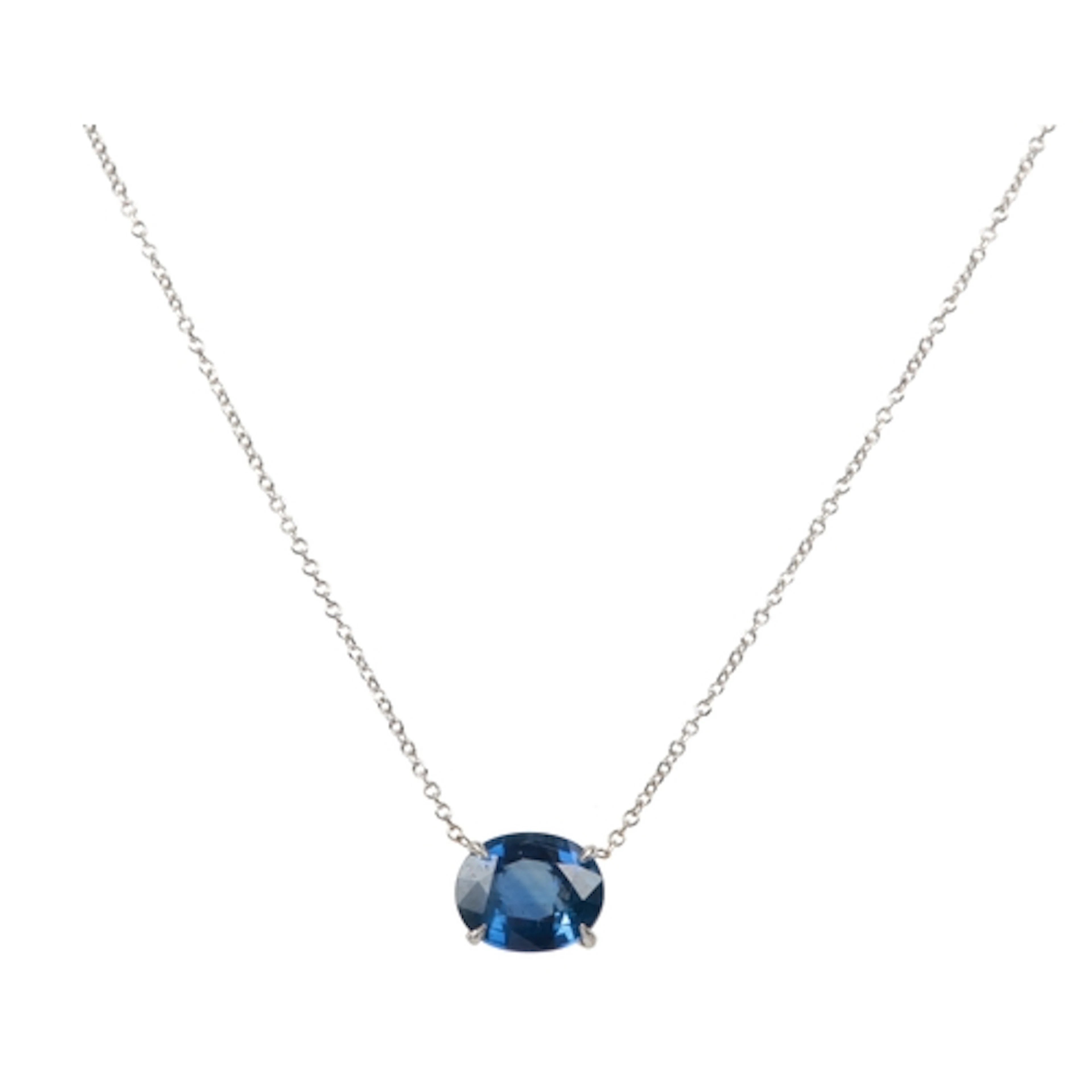 A sapphire pendant, claw-set with an oval sapphire measuring...