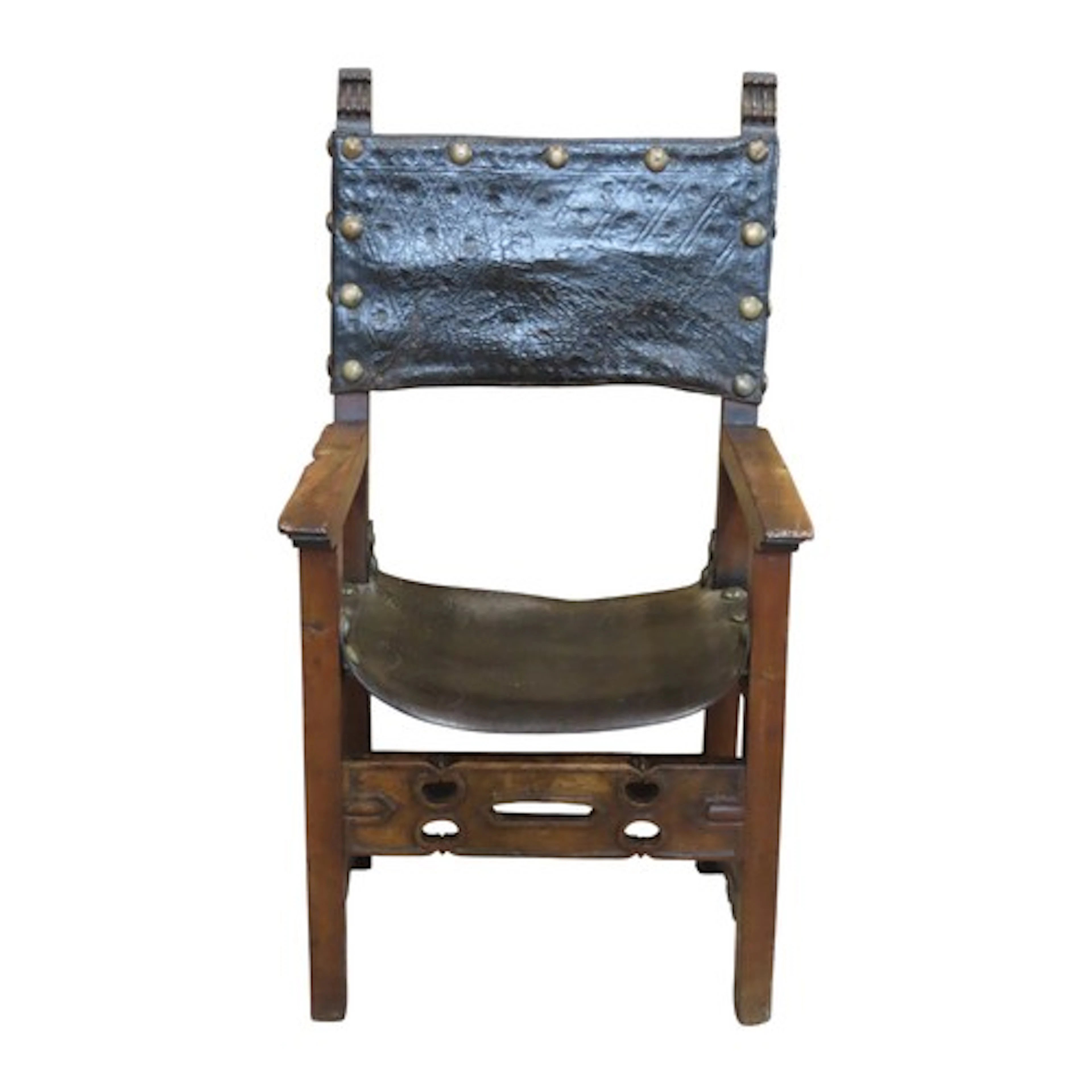 Antique Spanish open arm chair with tulled leather and brass...