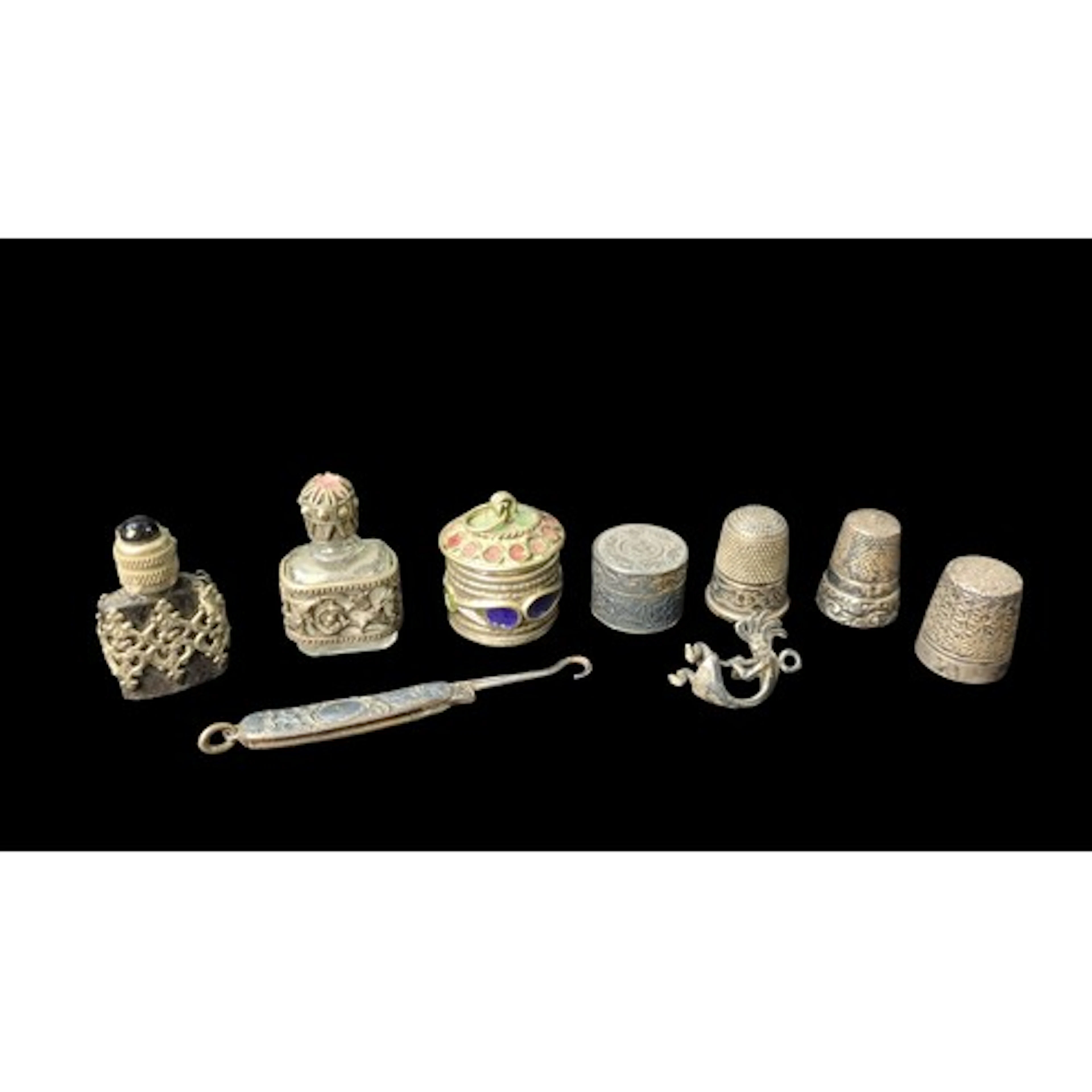 A group of miniature sewing and vanity accessories, includin...