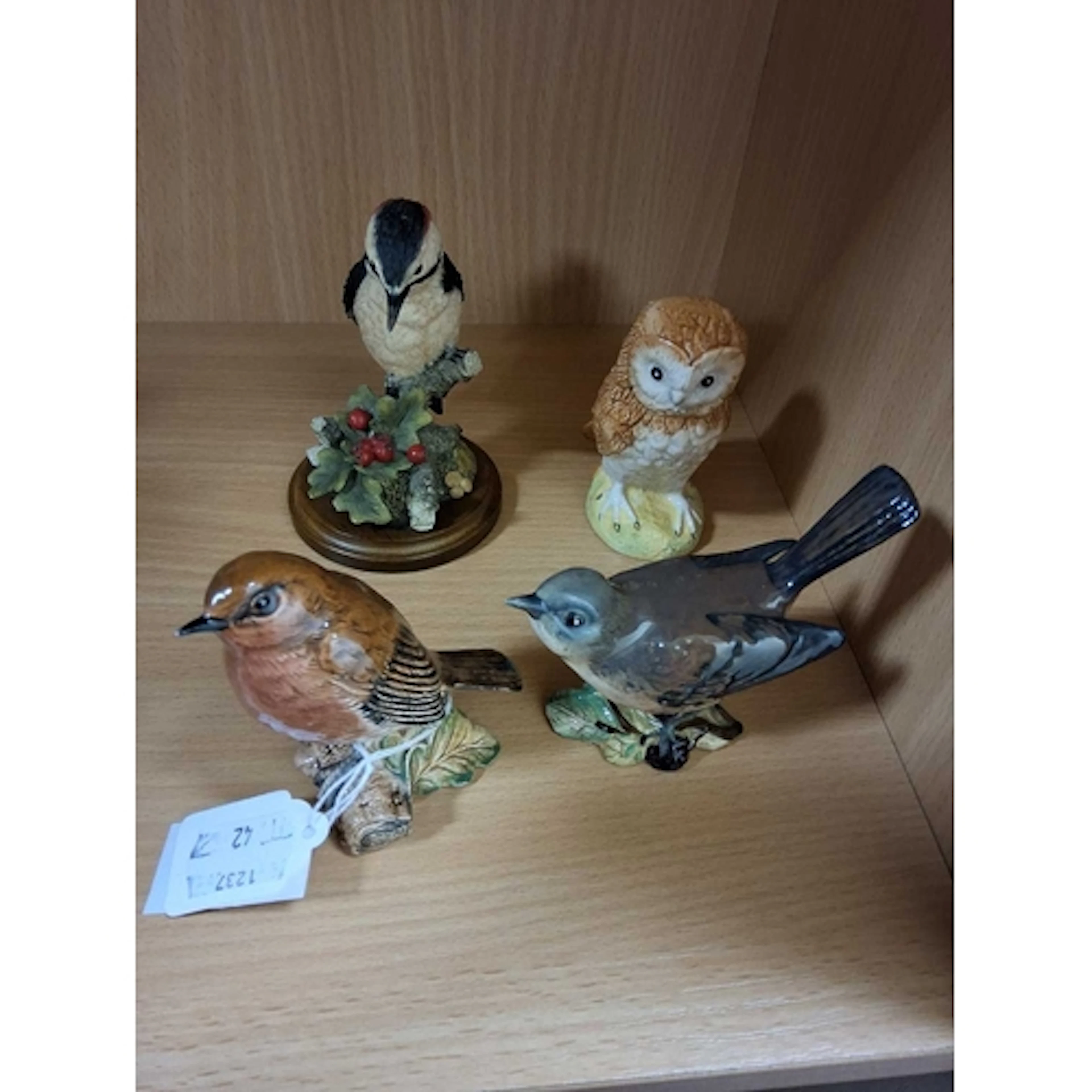 THREE BESWICK BIRDS AND A COUNTRY ARTISTS BIRD, comprising B...