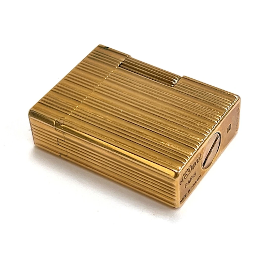 A French gold plated lighter by S T Dupont, Paris, 4.6cm hig...