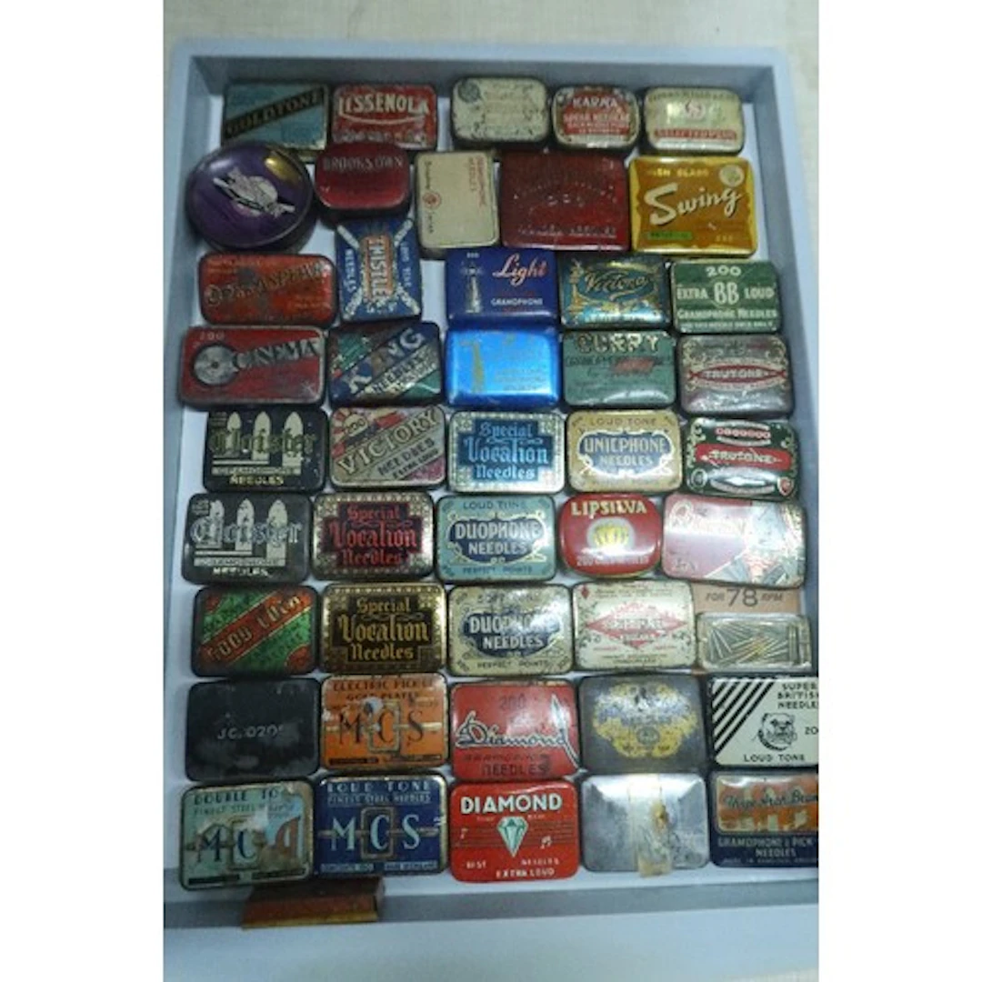A tray of vintage gramphone needle tins