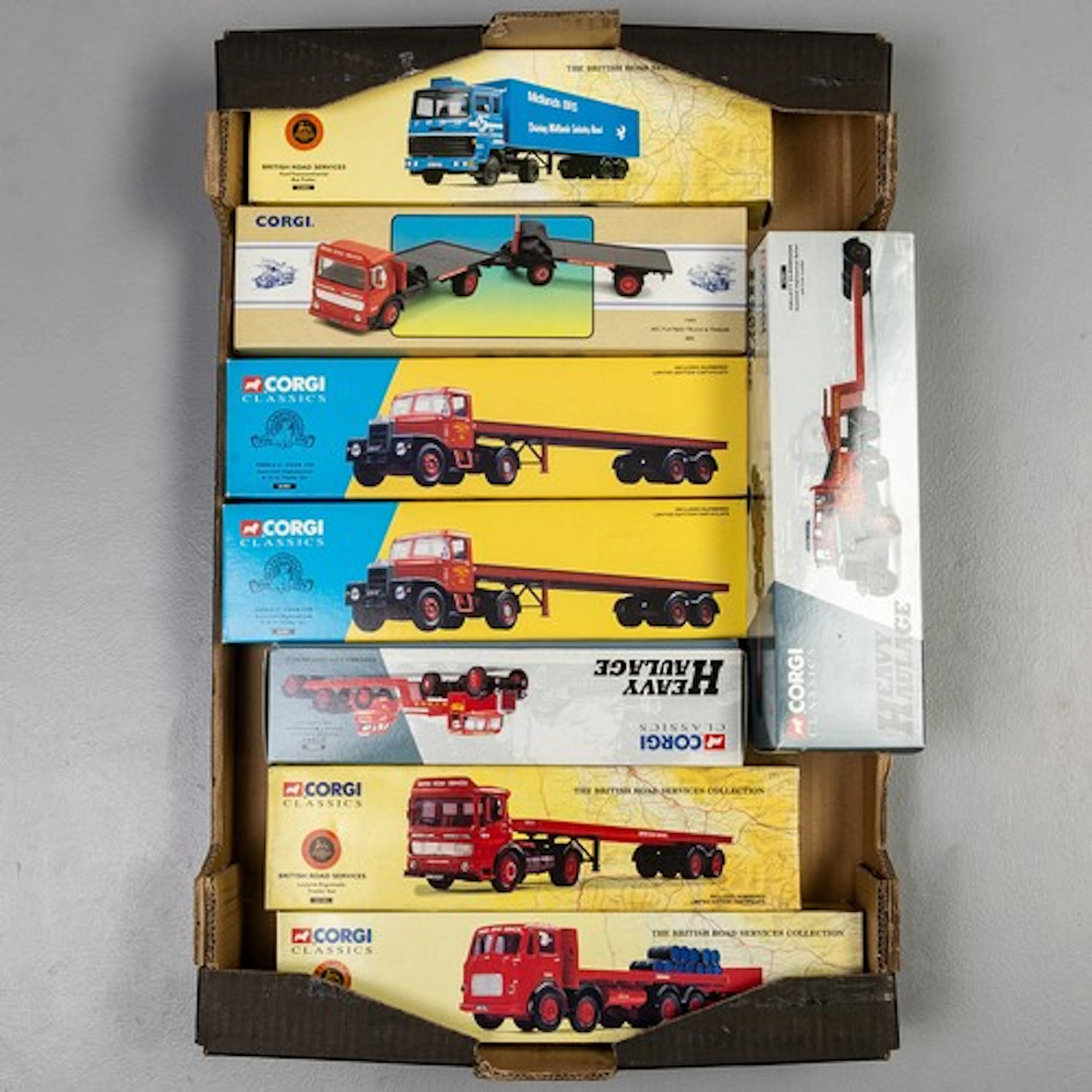 Fruit tray containing 8 boxed Corgi commercial vehicles to i...