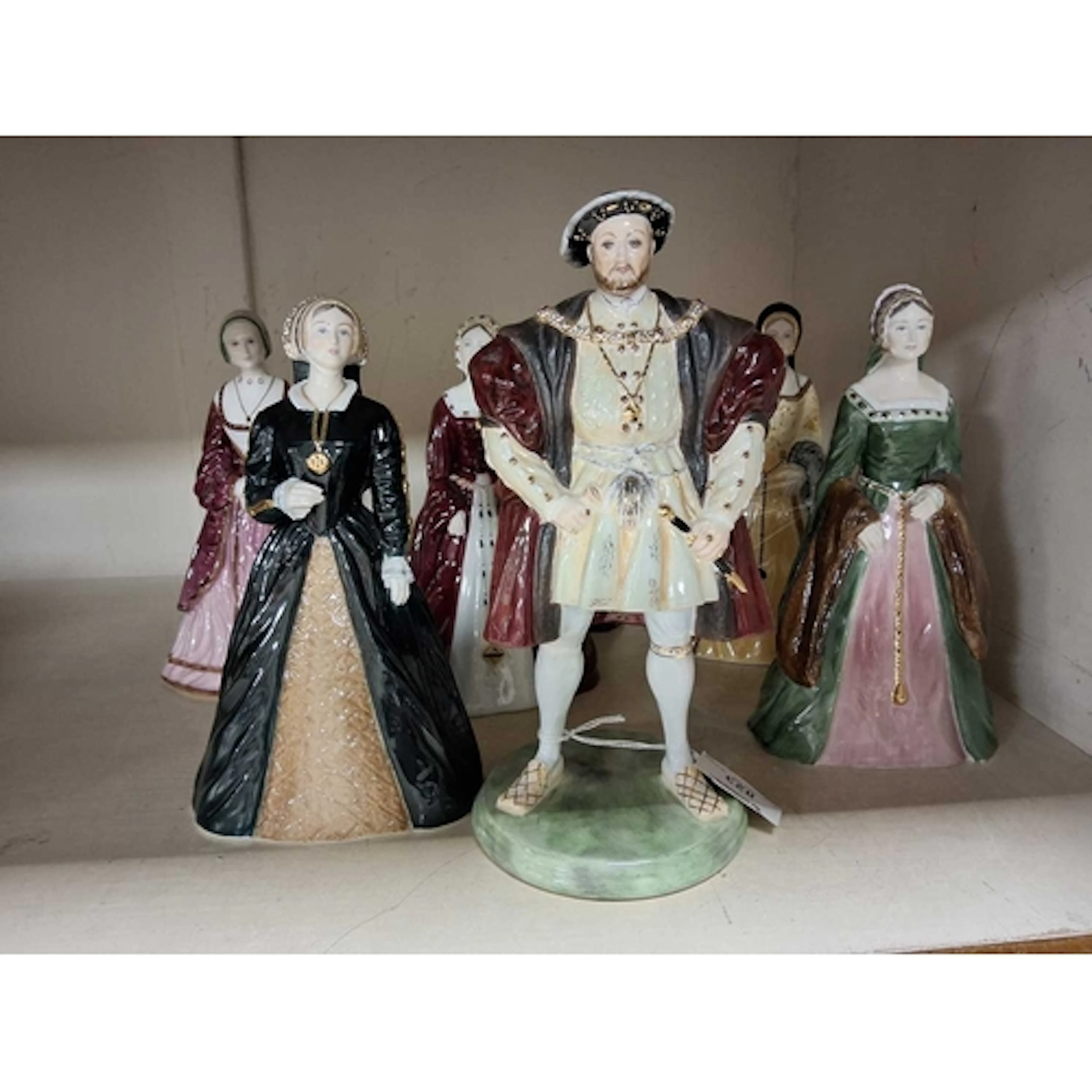 SEVEN COALPORT FIGURES - HENRY VIII AND HIS SIX WIVES, compr...