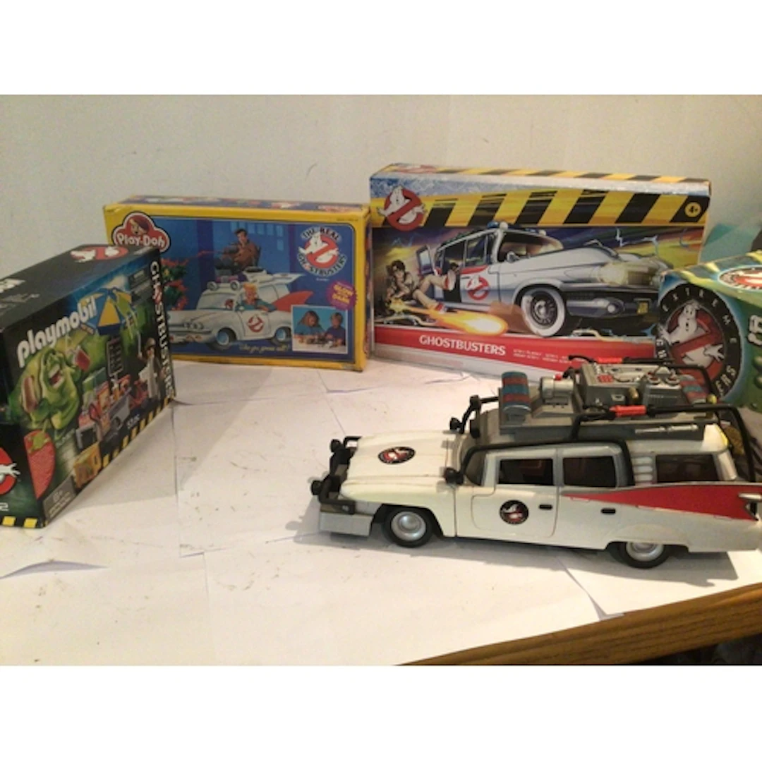 A collection of four boxed Ghostbusters toys, featuring unop...