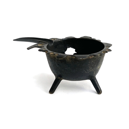 A small bronze oil lamp possibly c.1700 (af), 11cmH
