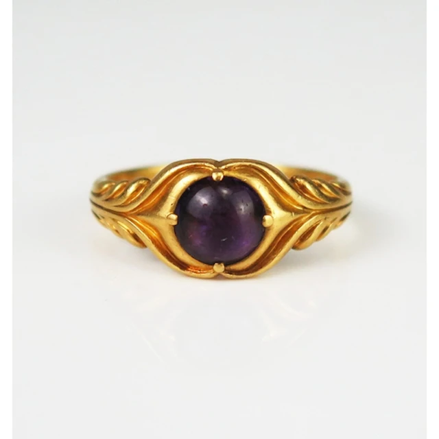 A 19th century foil backed amethyst ring in a high carat pre...
