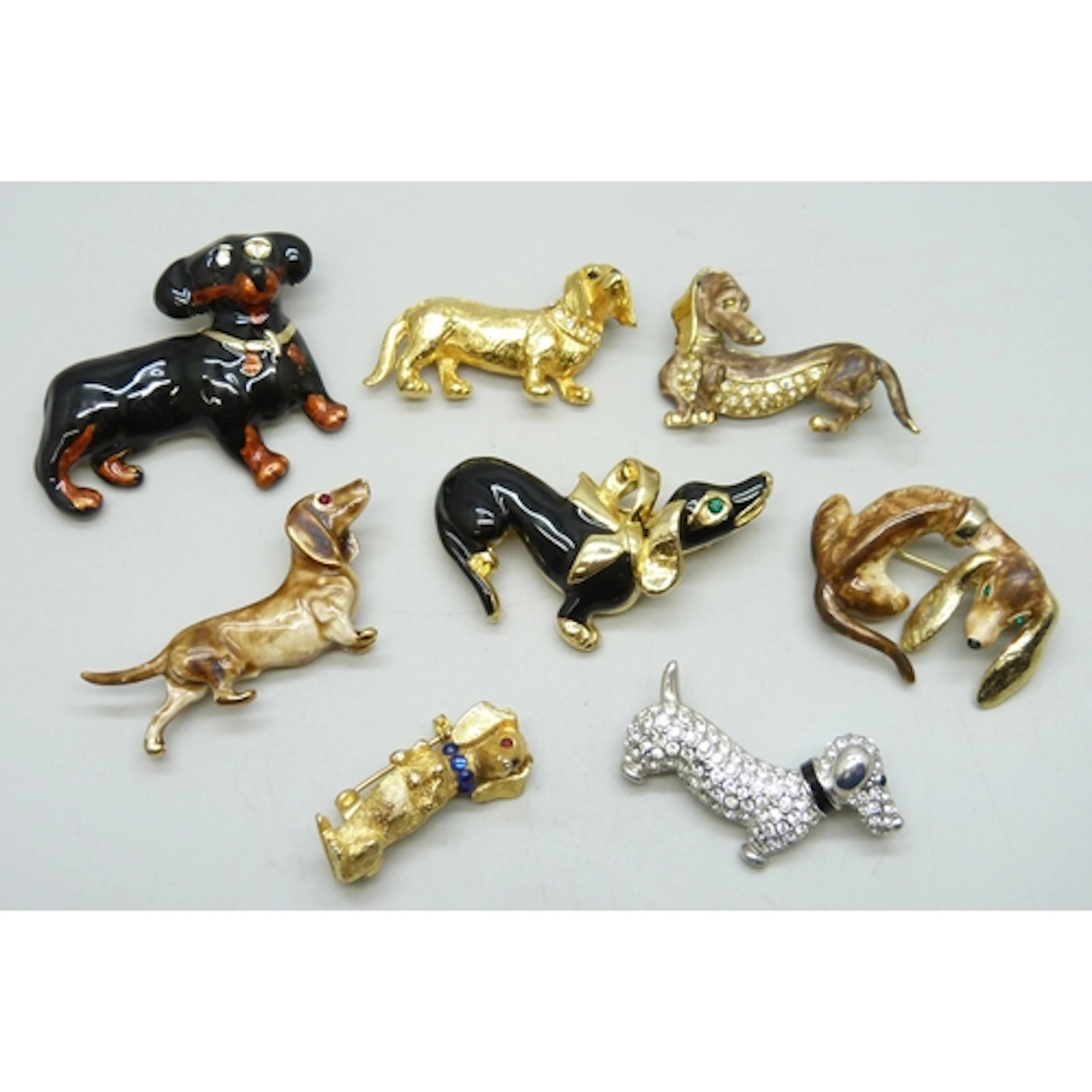 A collection of costume brooches in the form of dogs, includ...