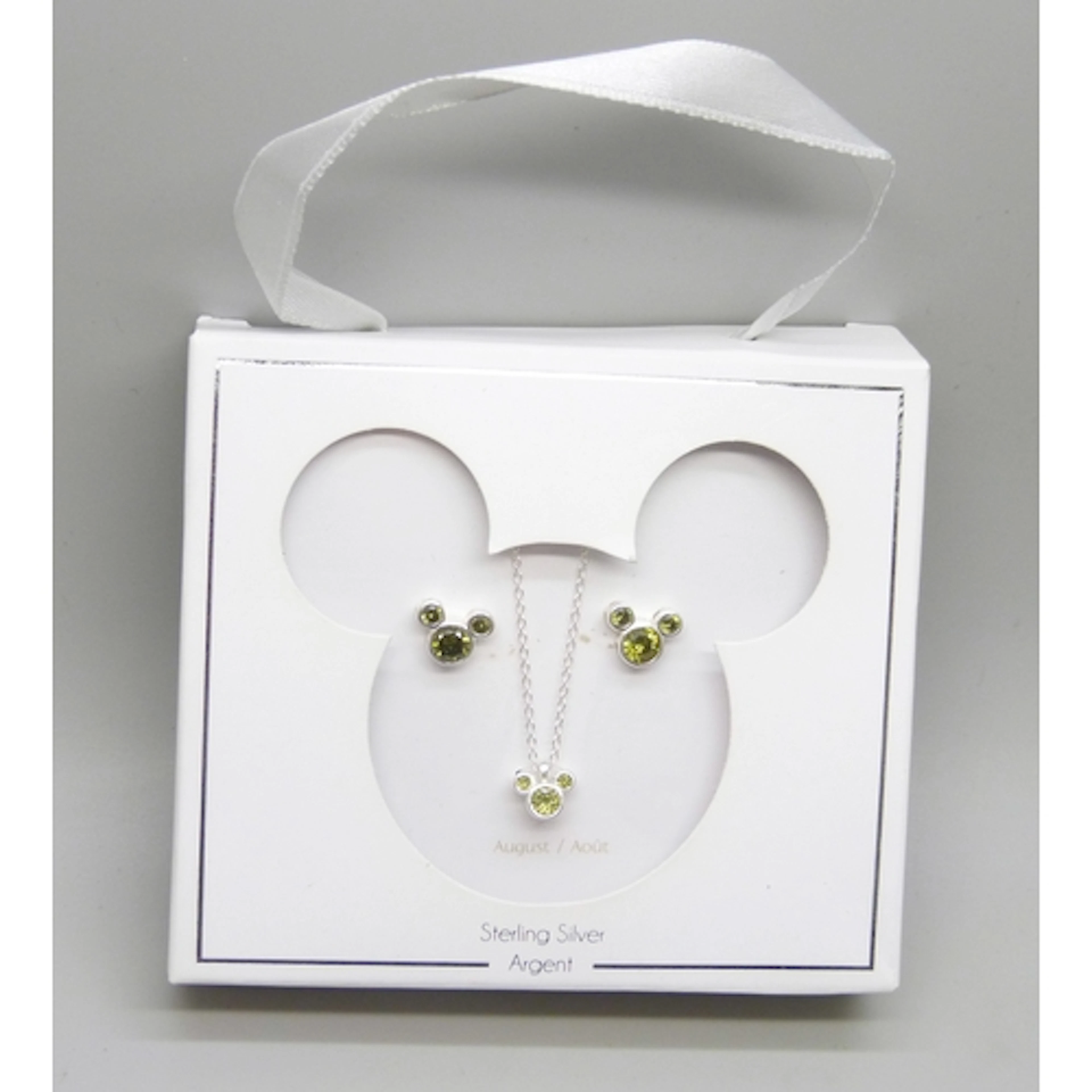 A Disney Store sterling silver and peridot jewellery set in ...