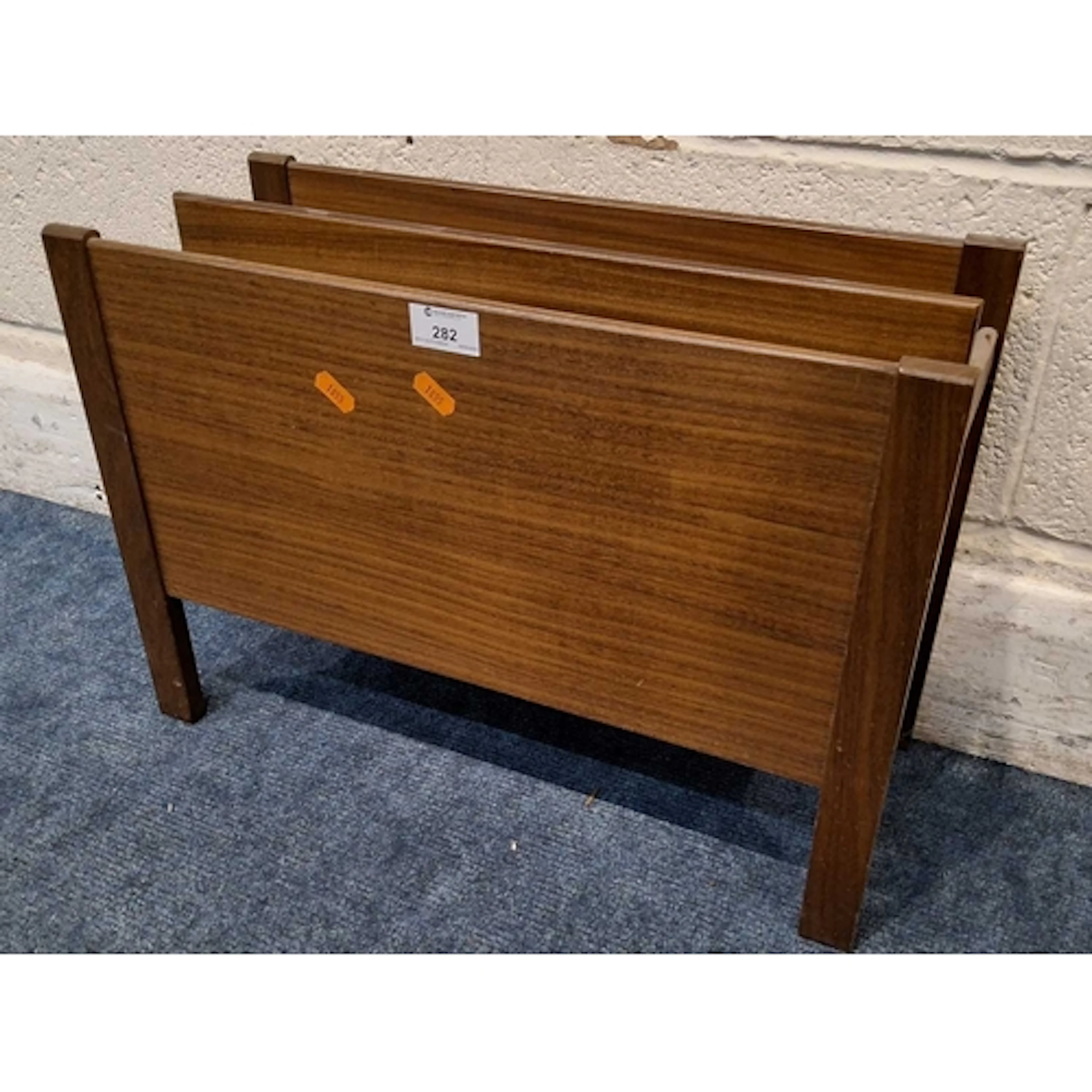 POSSIBLY GUY ROGERS, A MID-CENTURY TEAK MAGAZINE RACK (widt...
