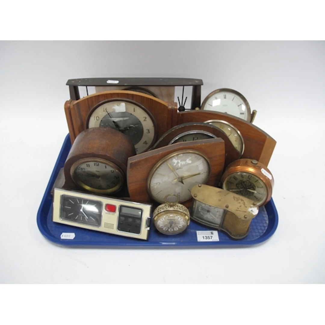 Eleven vintage mantel clocks in various forms, including Ger...