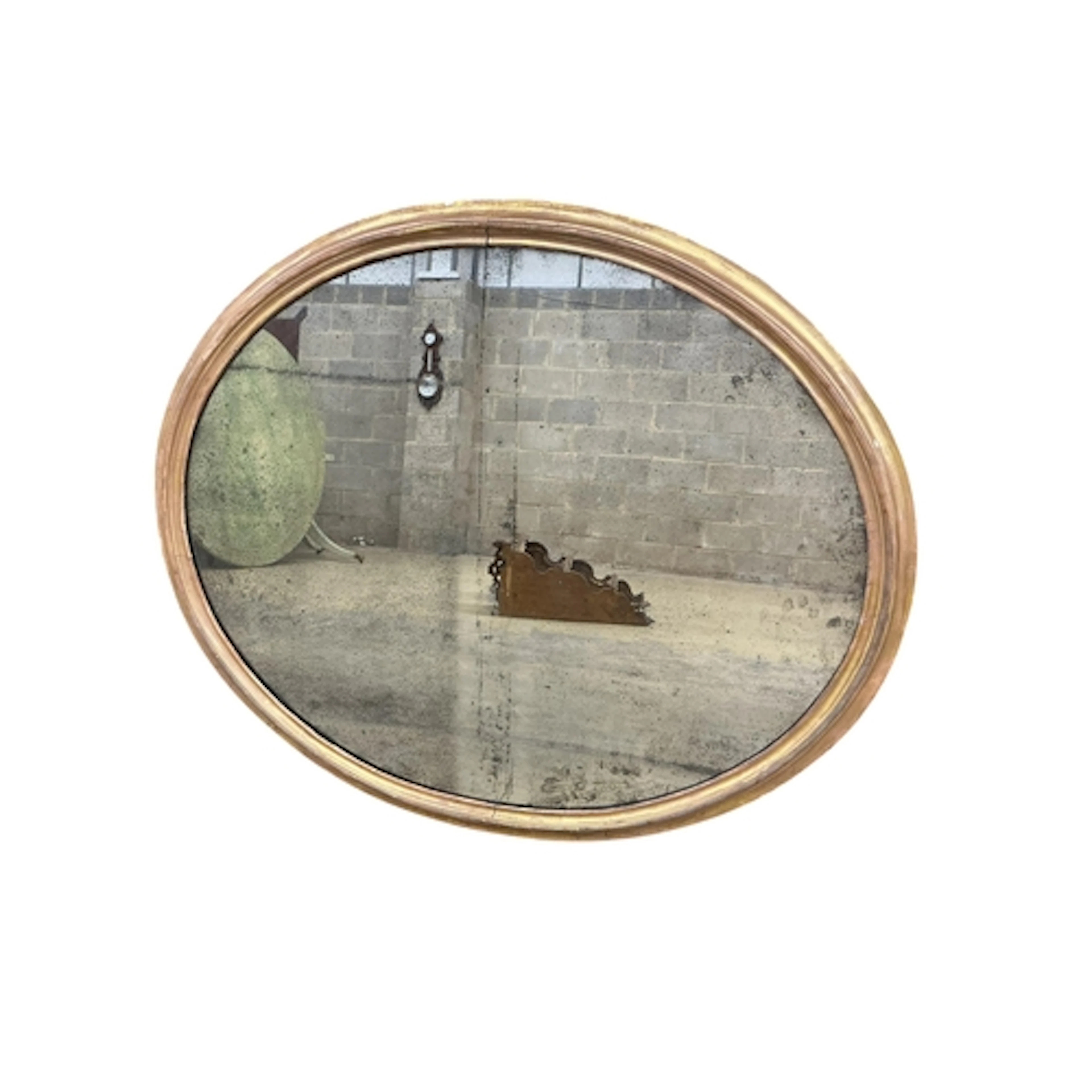 A large Victorian oval giltwood and composition wall mirror,...