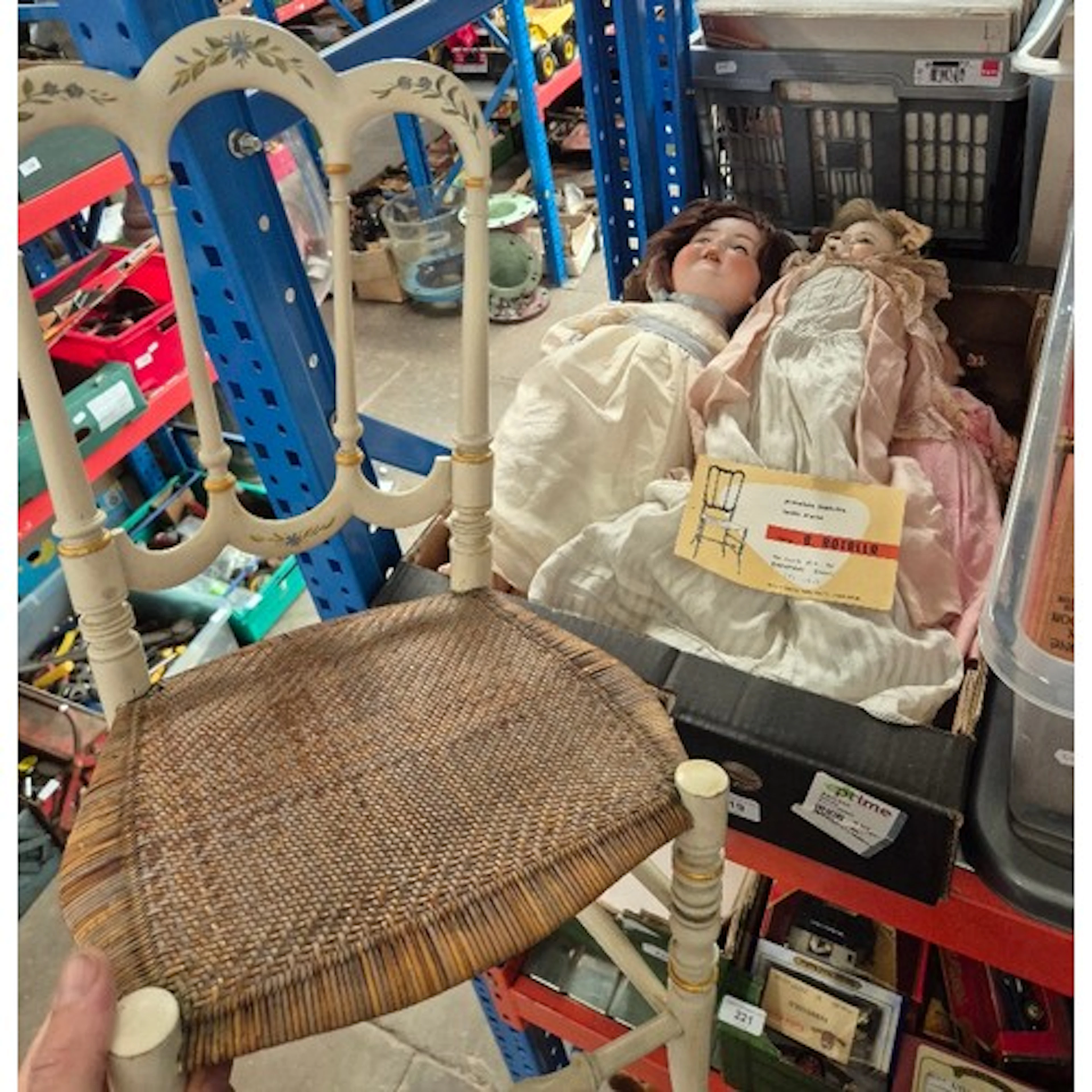 An antique papier mache headed doll with original clothing t...