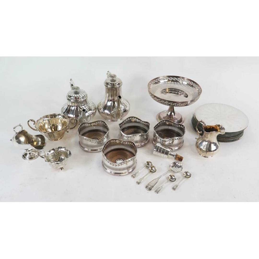 Assorted silver plated wares including placemats, wine coast...