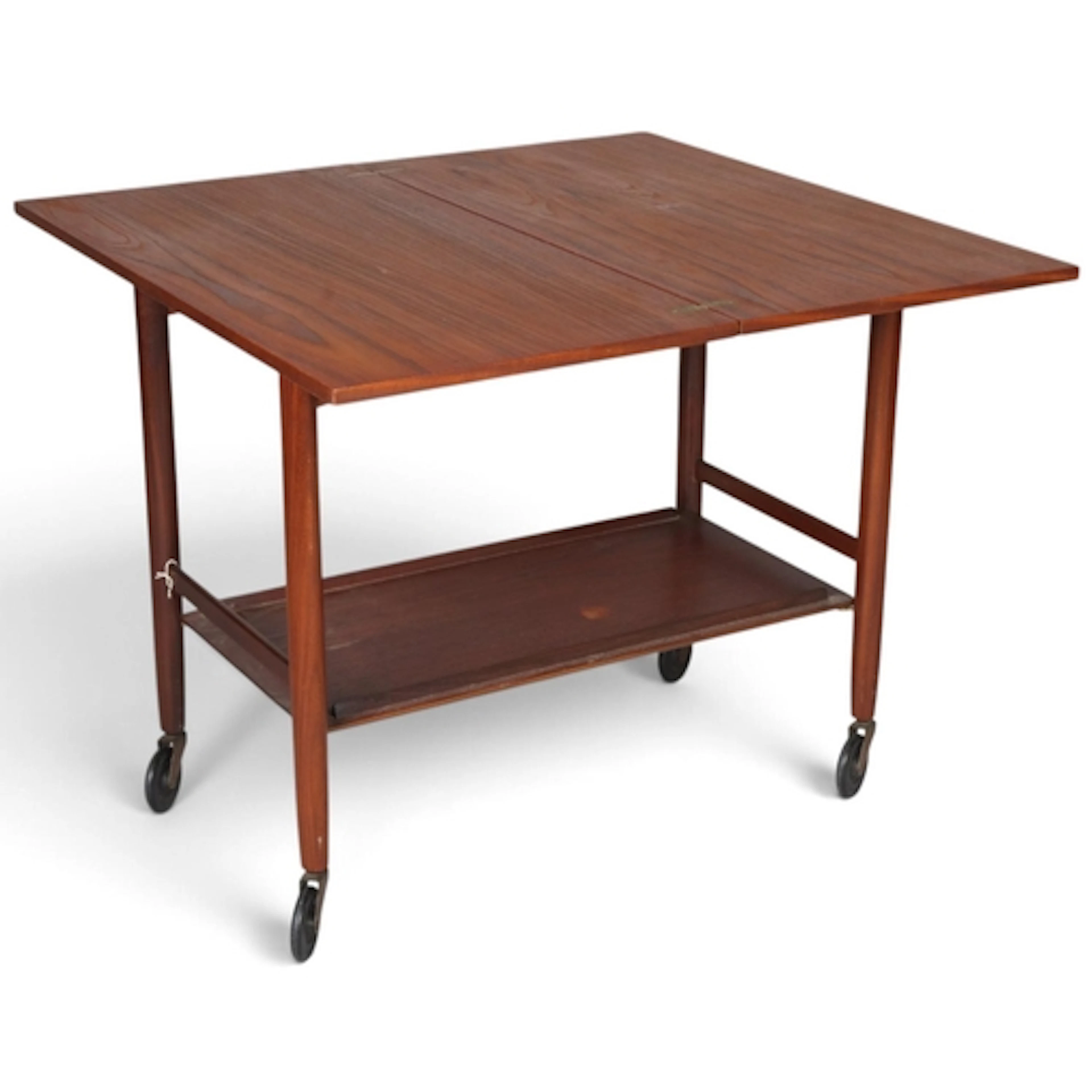 A mid-century teak two-tier trolley with fold-over leaf and ...