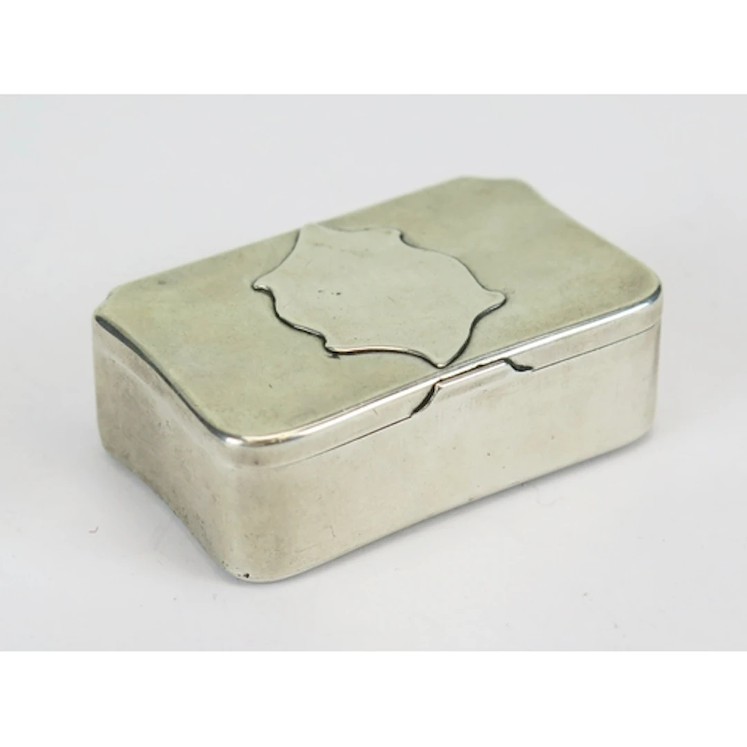 A Russian silver snuff box, of rectangular outline with appl...