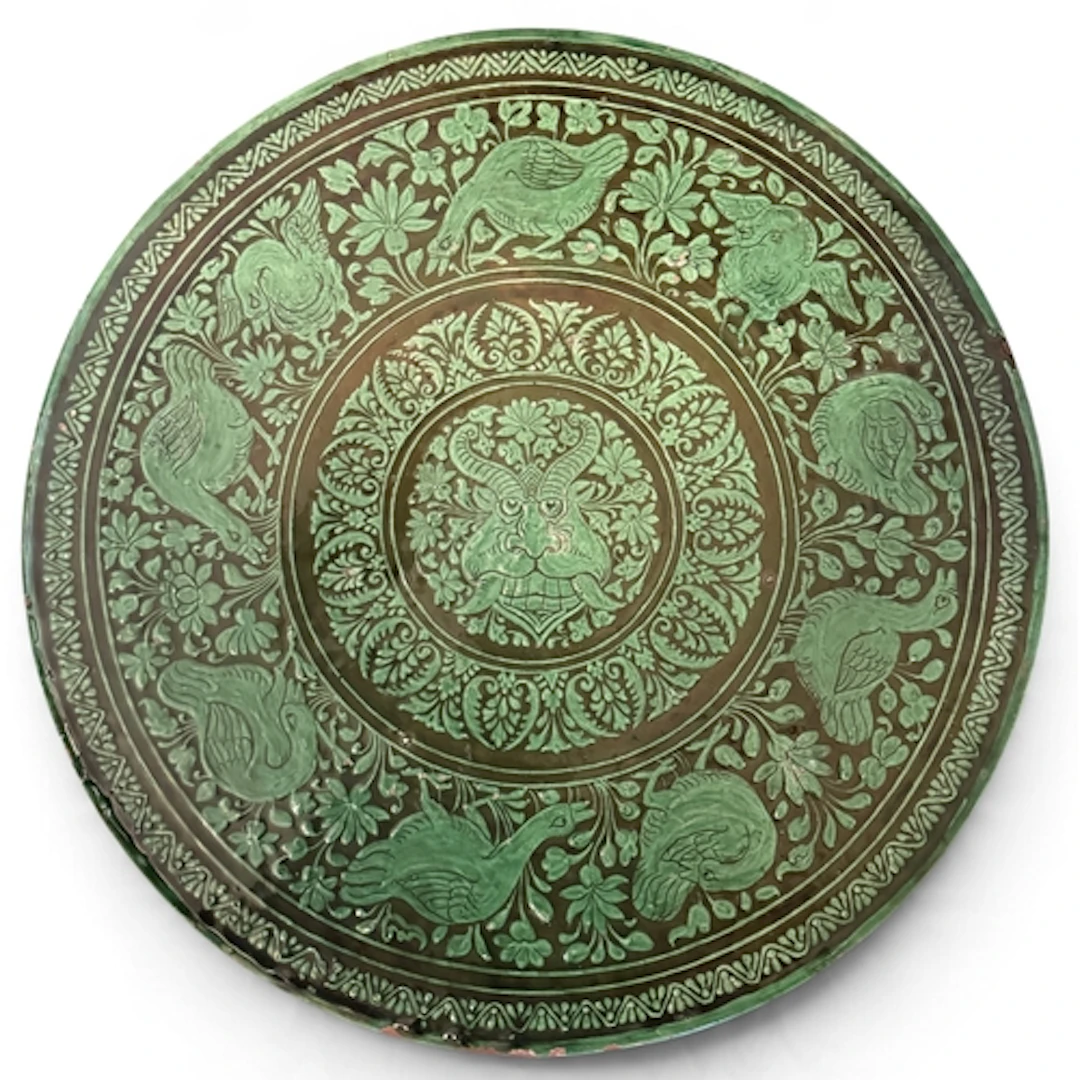 A LARGE INDIAN TERRACOTTA PLATTER WITH GREEN GLAZE Possibly ...