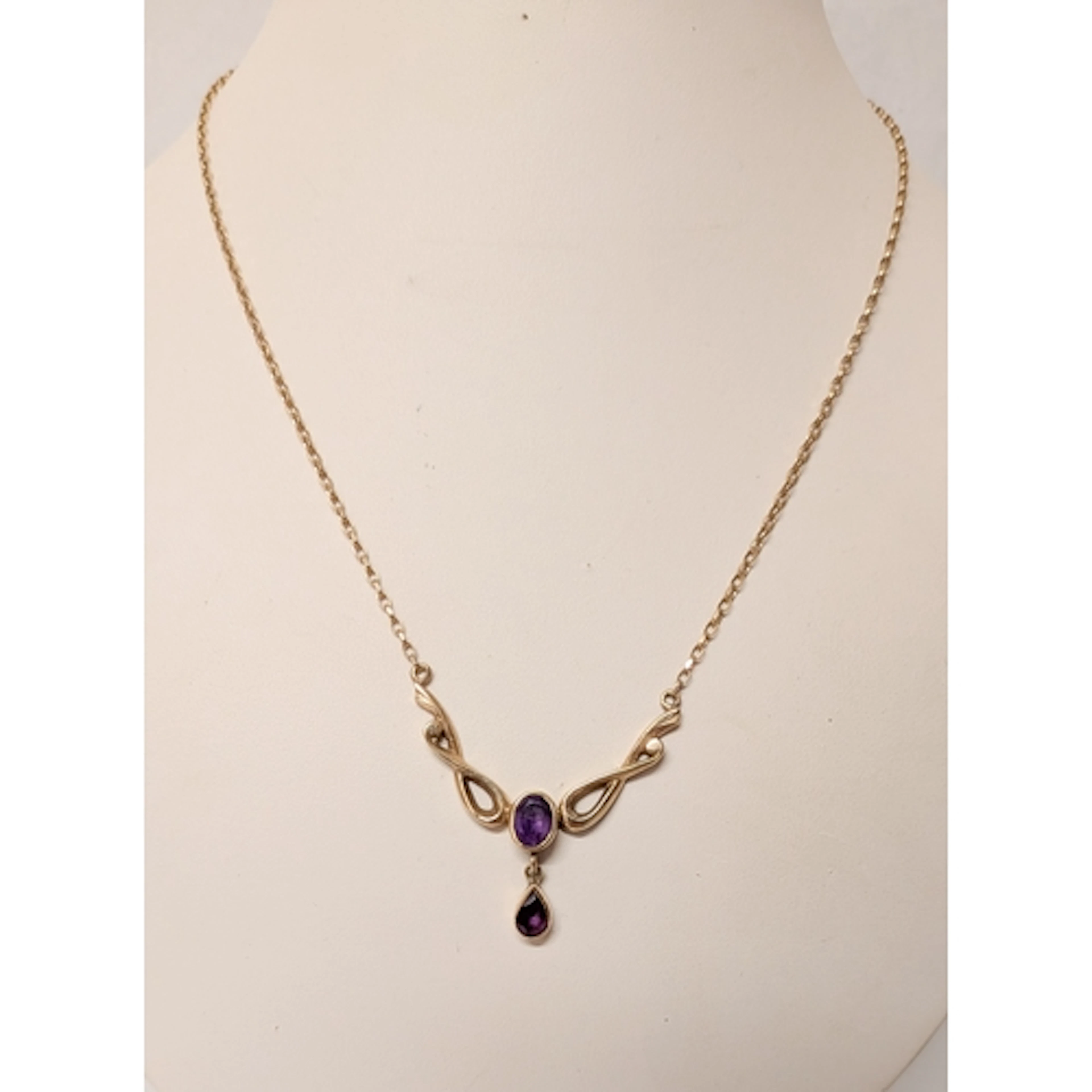 A 9ct gold Art Nouveau style amethyst pendant dropper neckla...