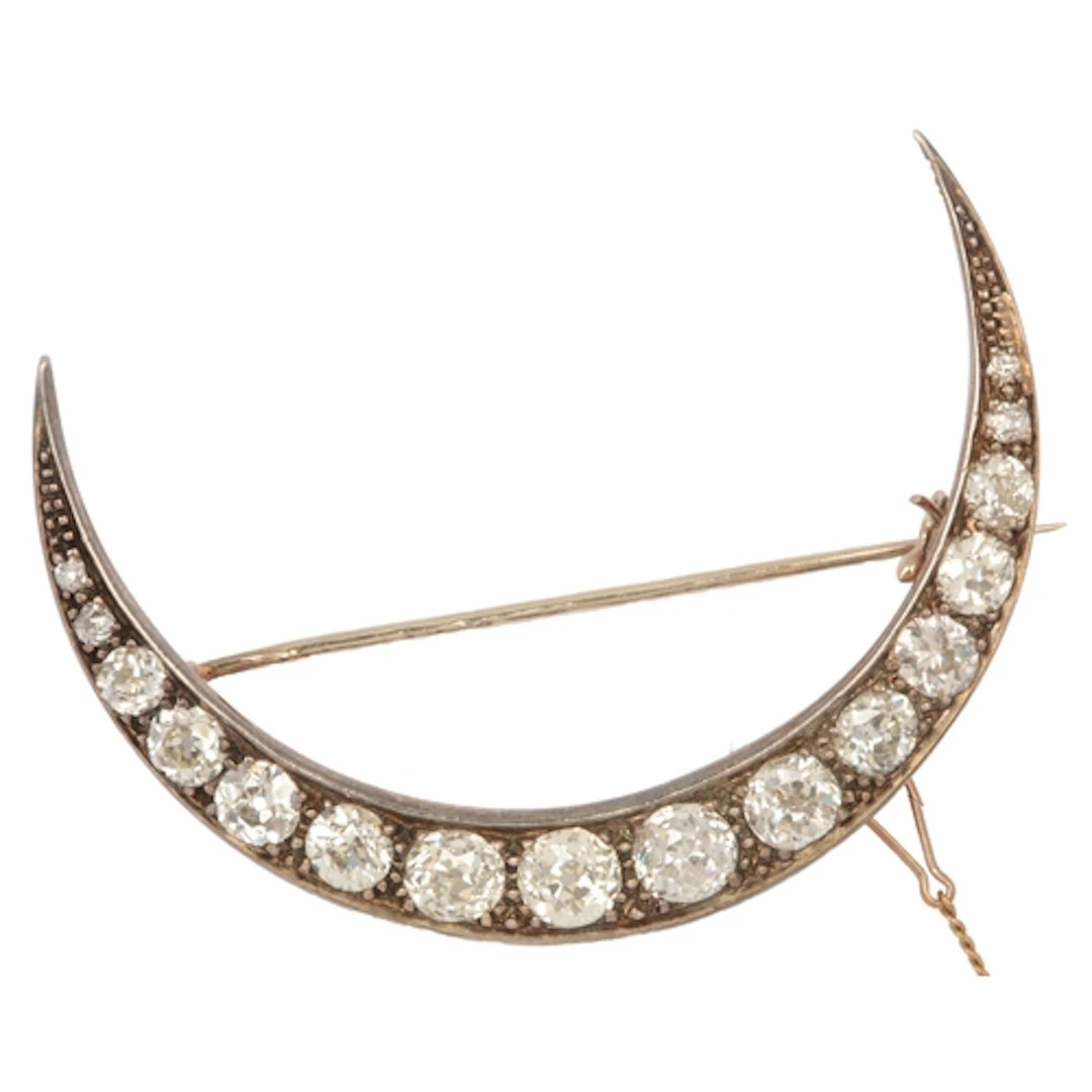 A Victorian diamond crescent moon brooch, circa 1900, set wi...