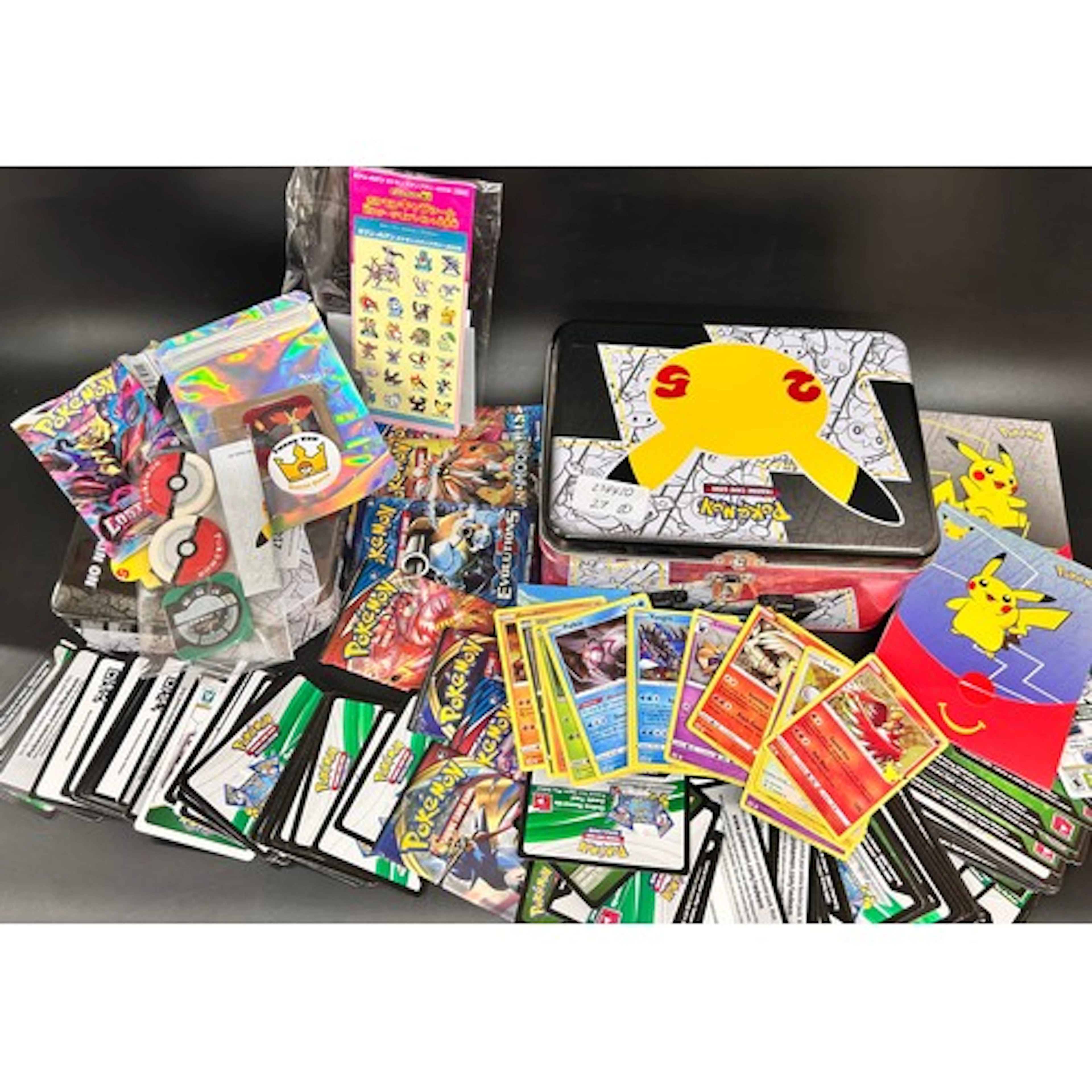 A collection of Pokémon 25th Anniversary items including McD...