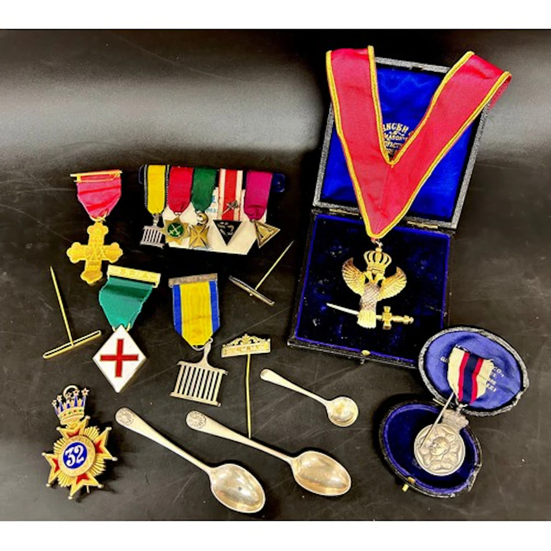 A silver and enamel jewel, a silver Masonic eagle jewel, oth...