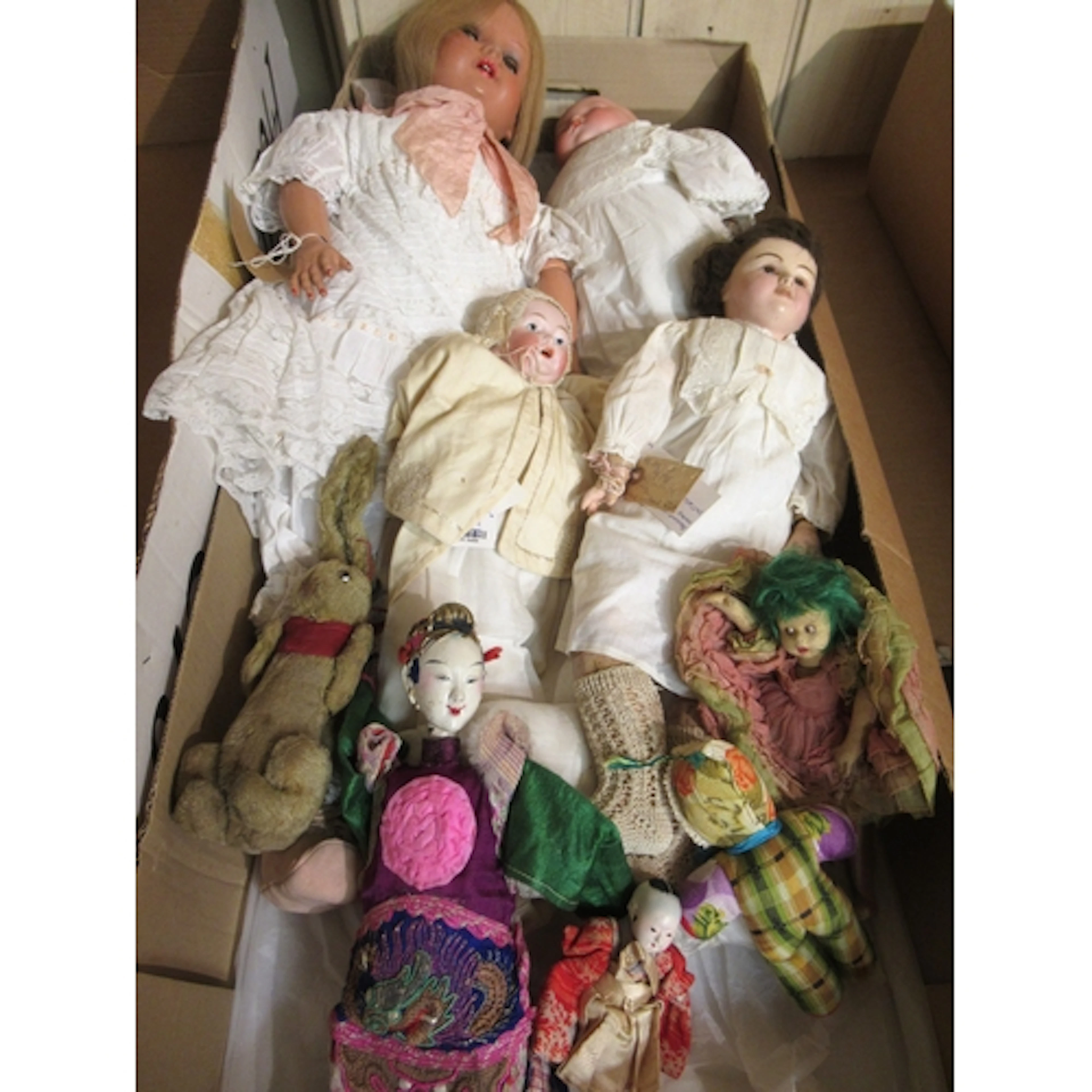 Box containing a quantity of various dolls, including two ba...
