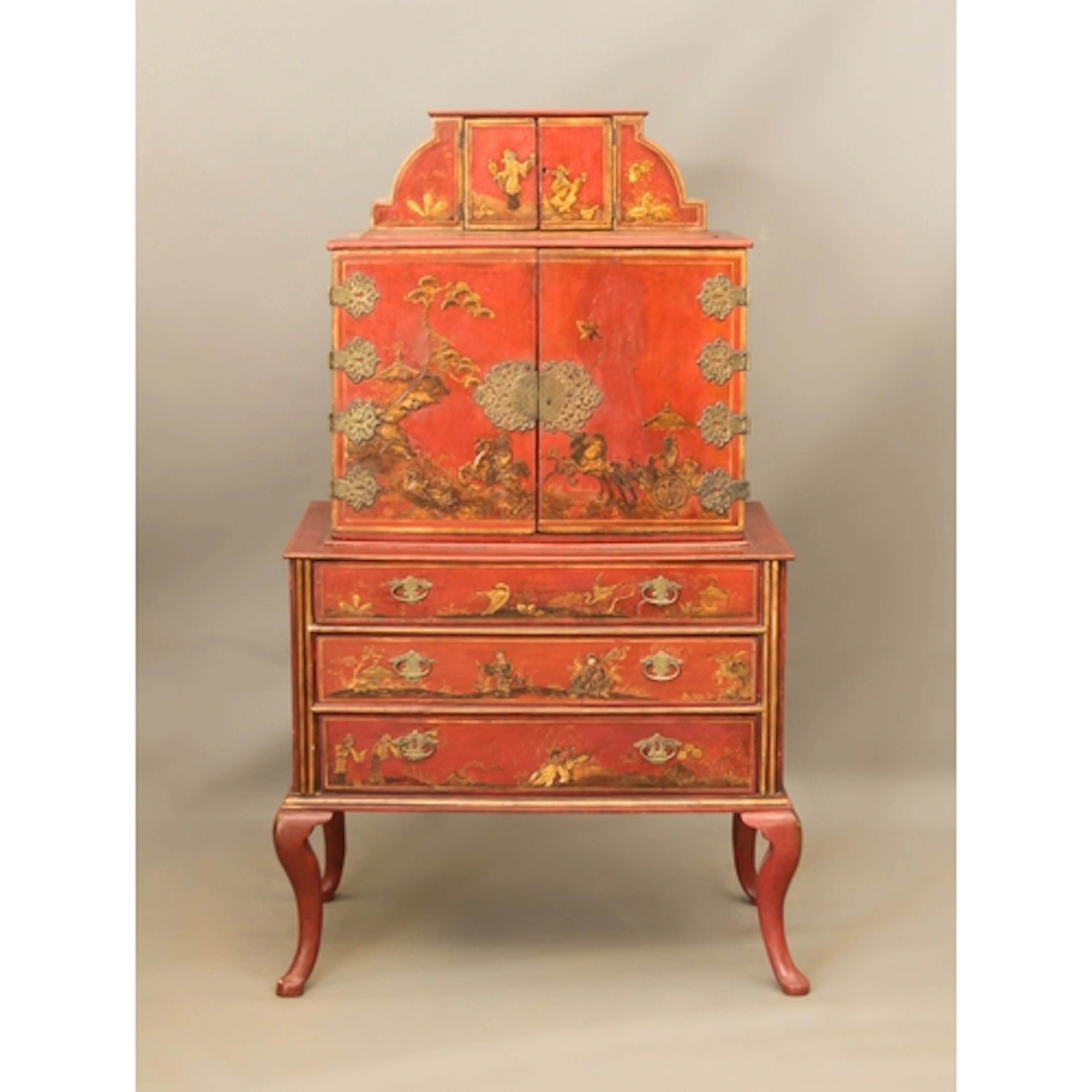 An 18th century red japanned chinoiserie cabinet on stand, o...