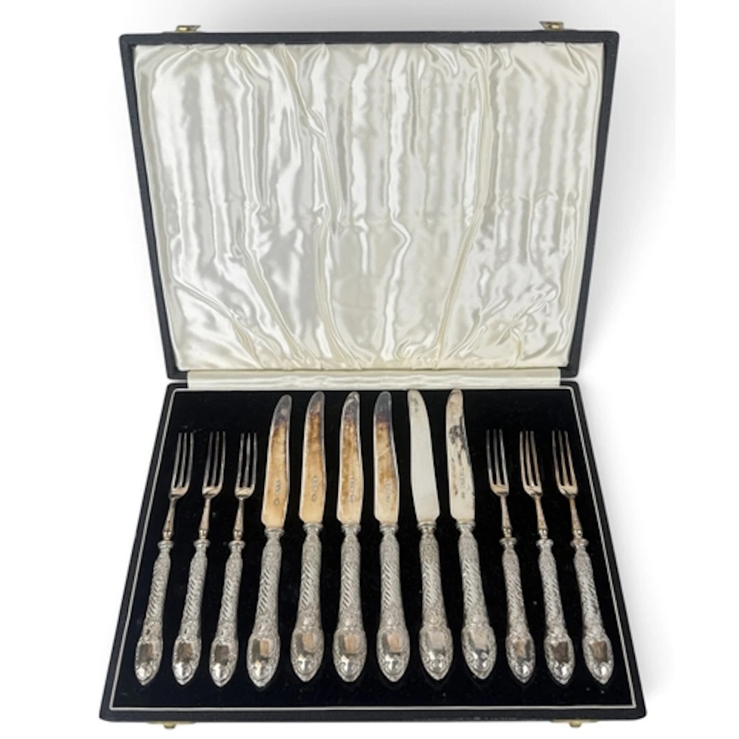 A SET OF SIX PAIRS OF LATE VICTORIAN SILVER DESSERT KNIVES A...