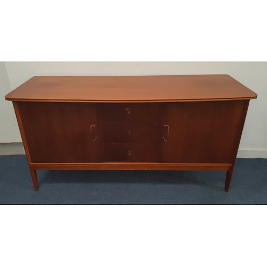 MID-CENTURY TEAK SIDEBOARD with bowed front, featuring a ce...