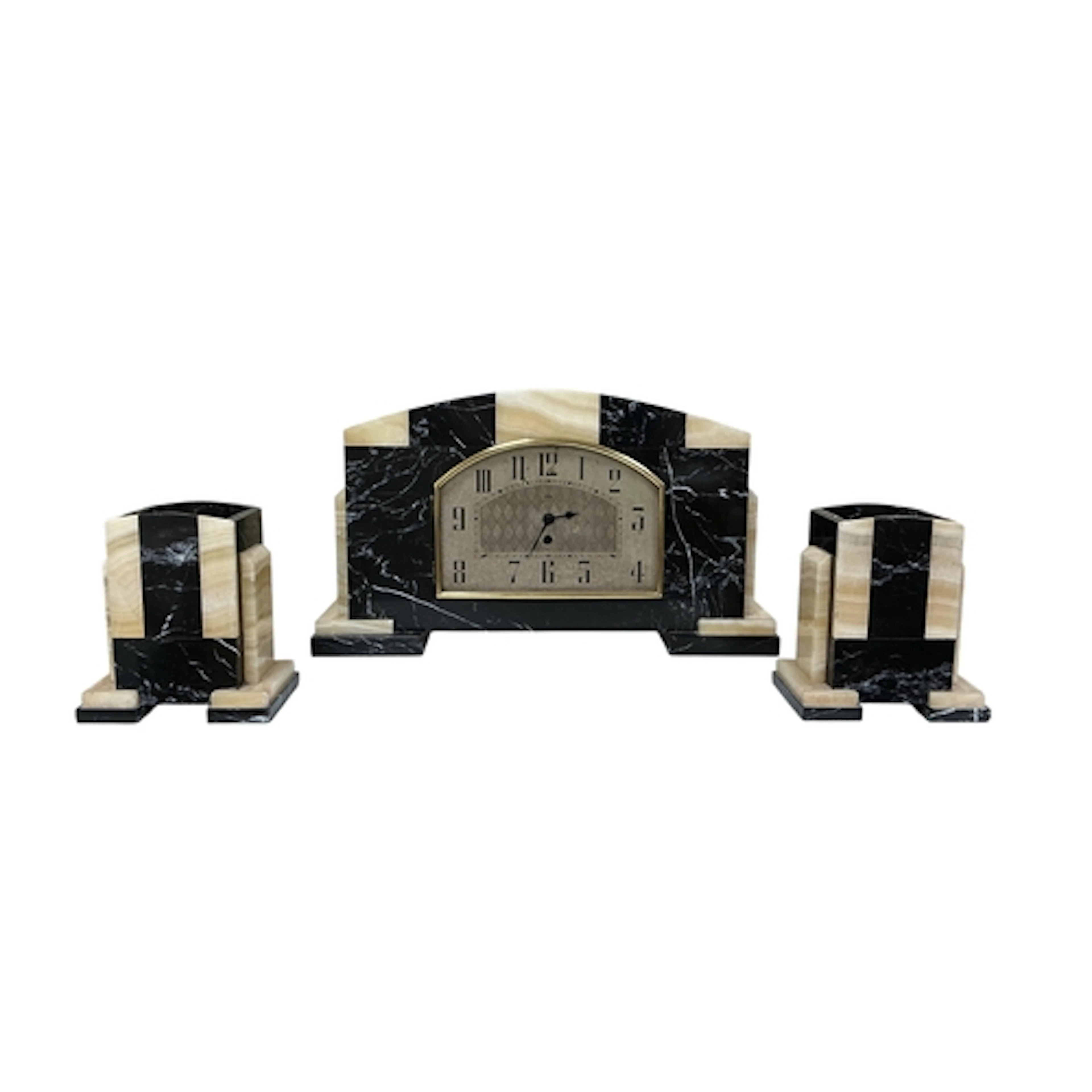 An Art Deco marble and alabaster clock garniture, the dial i...