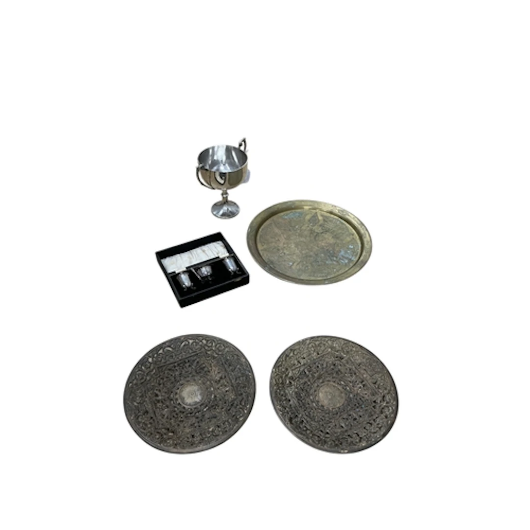 A mixed group of metalware comprising a Middle Eastern engra...