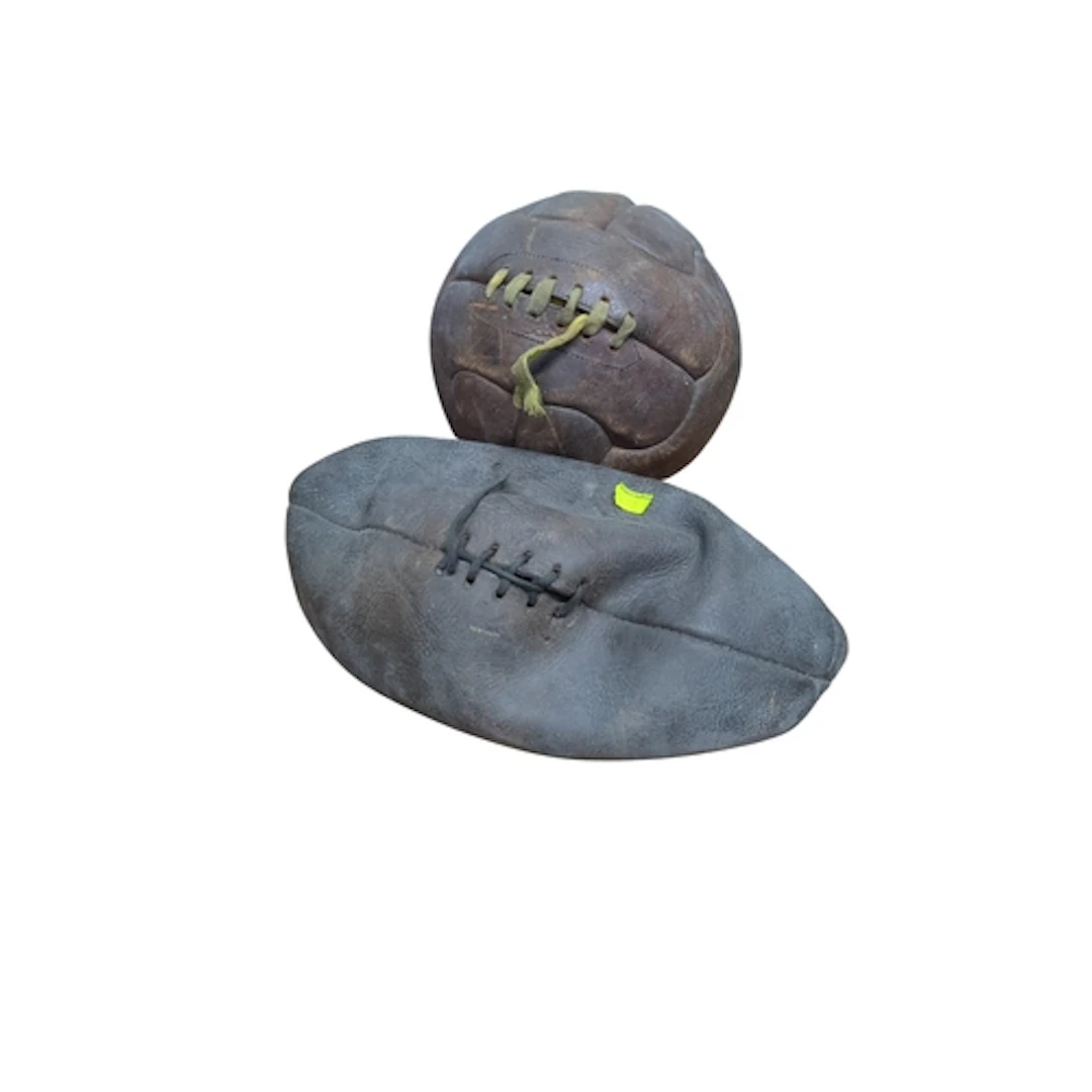 A pair of leather footballs comprising a panel-stitched asso...