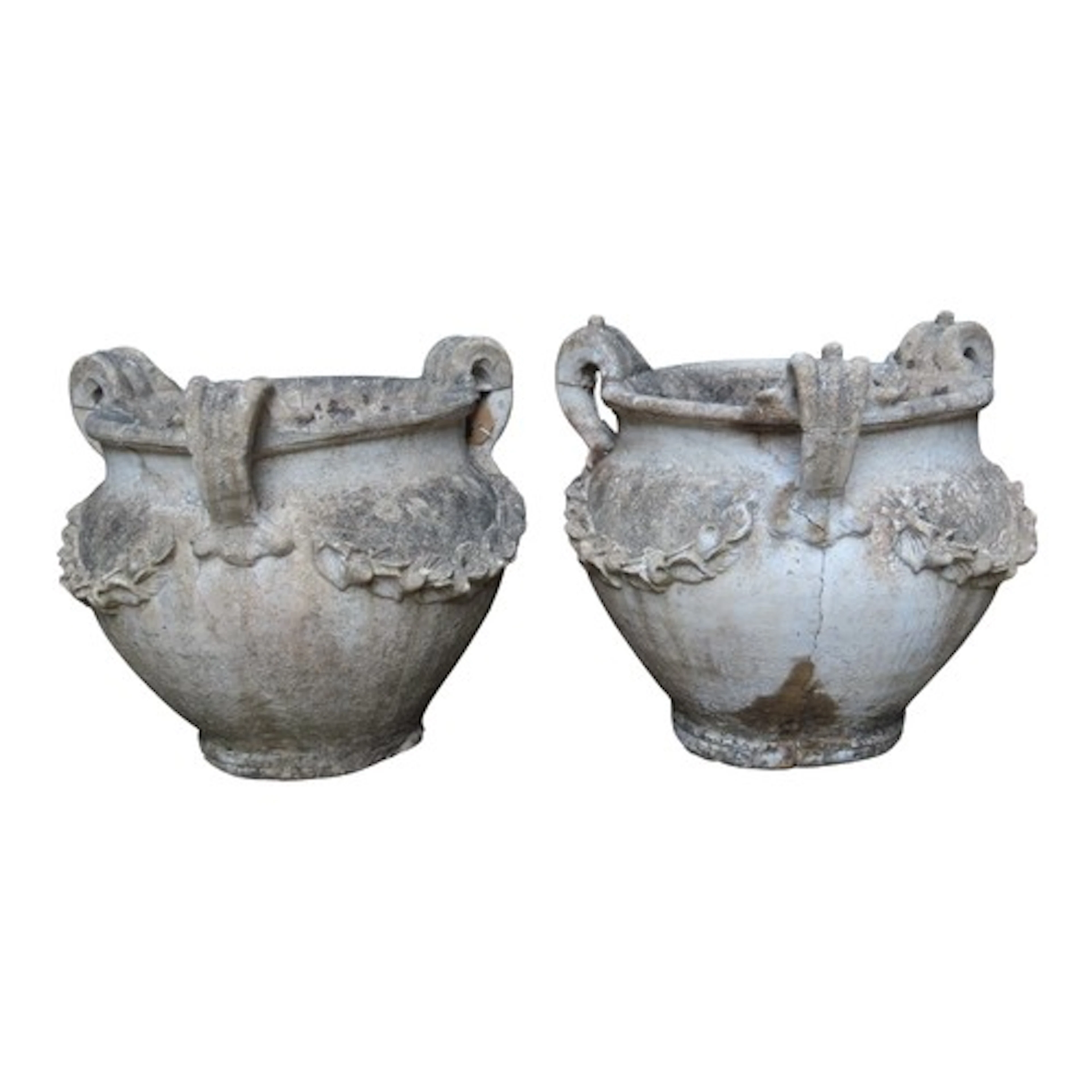 A pair of weathered cast composition stone three handled urn...