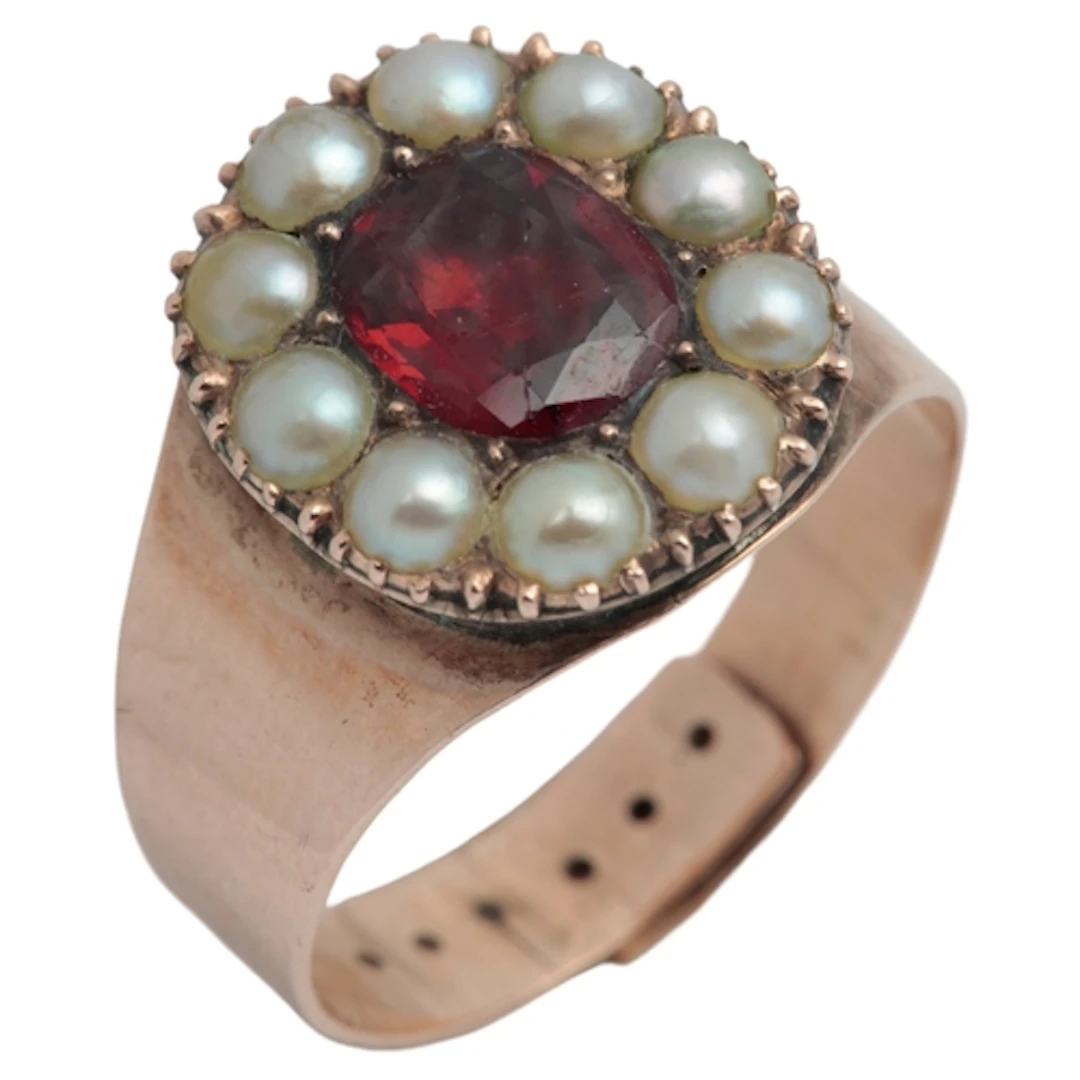 A garnet and pearl cluster ring, 19th century, of cluster de...