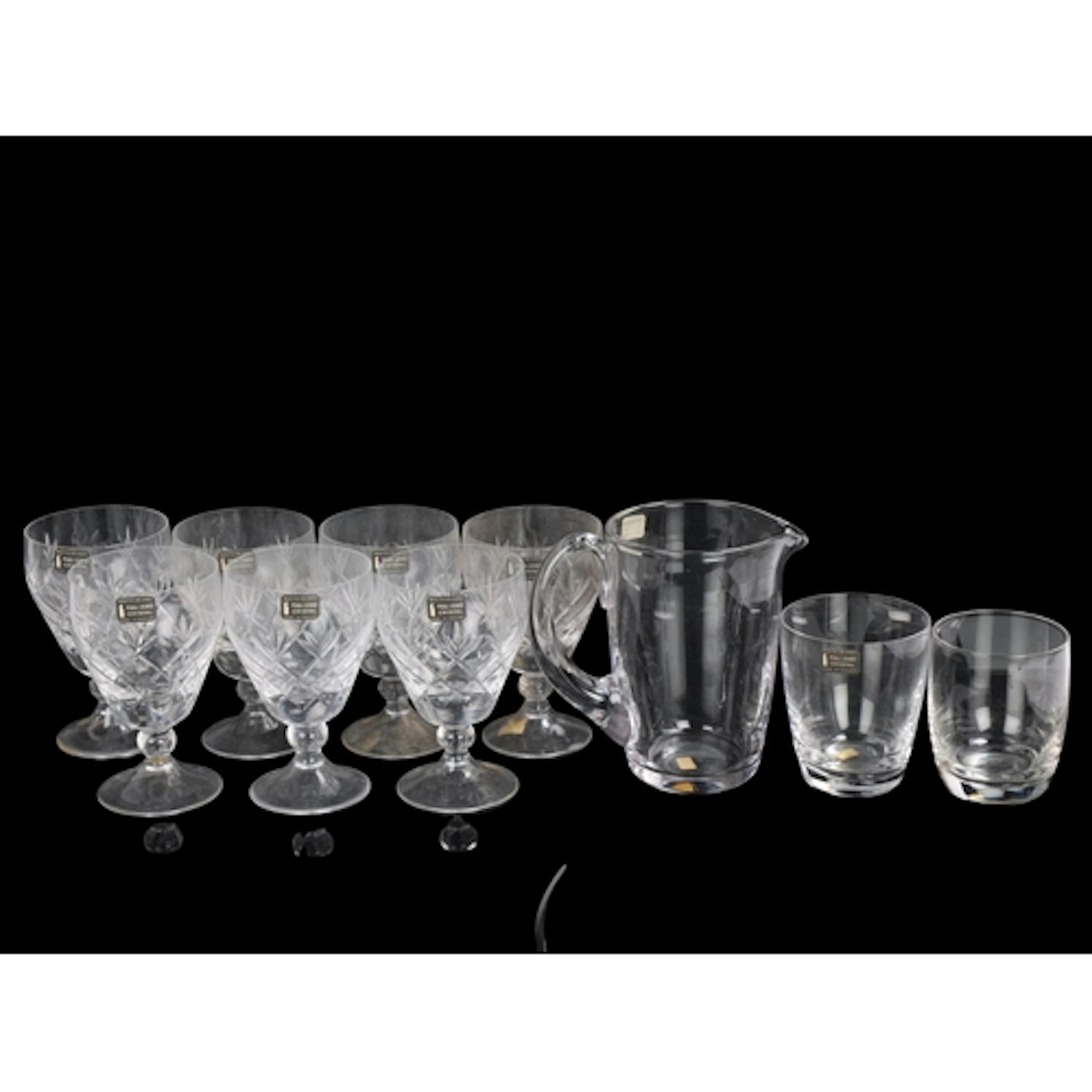 A Whitefriars Glass water jug and two whiskey tumblers in or...