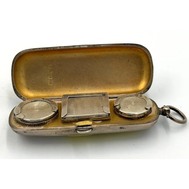 A hallmarked silver sovereign, half sovereign and stamp hold...