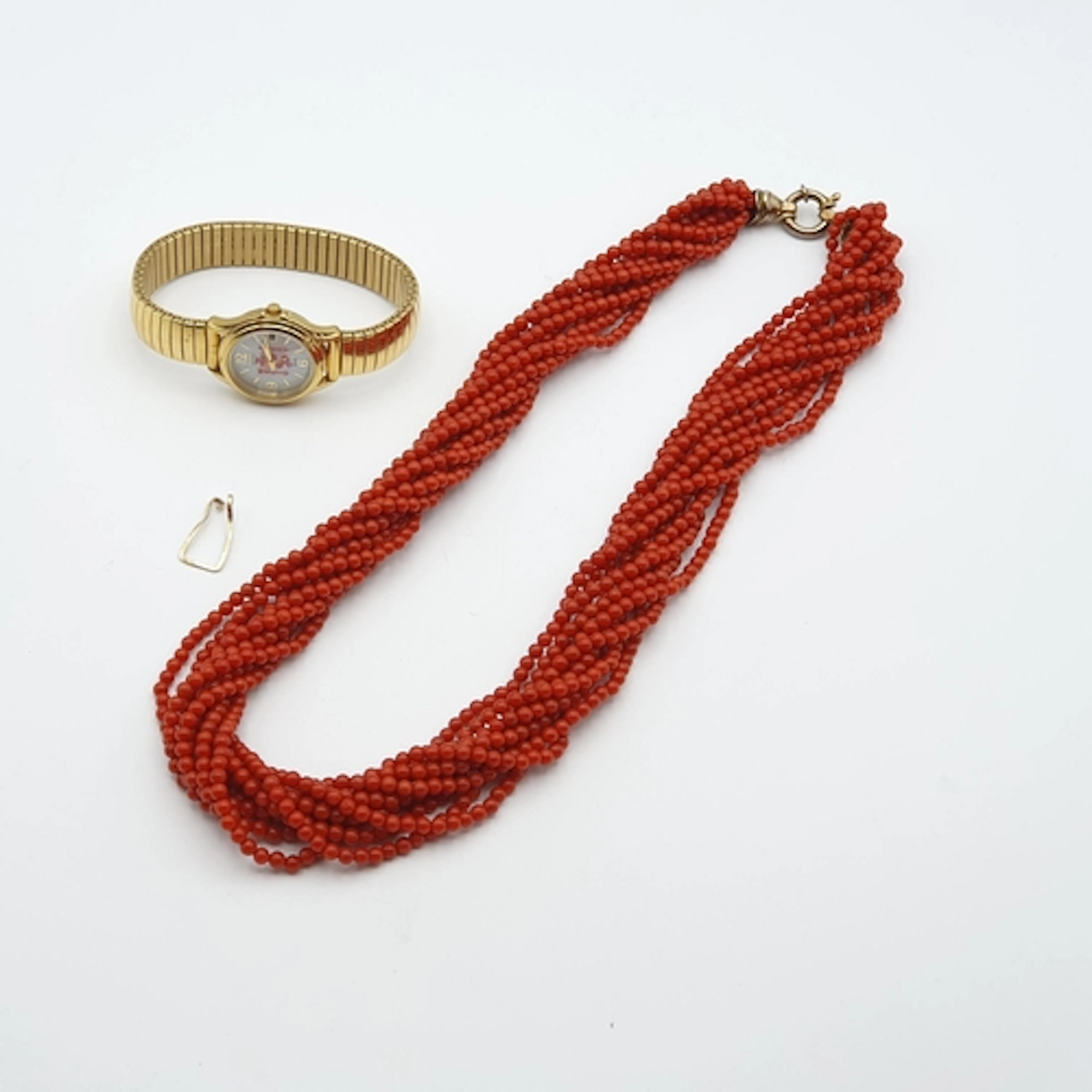 A multi-strand Red Bead Necklace on gold-plated clasp stampe...
