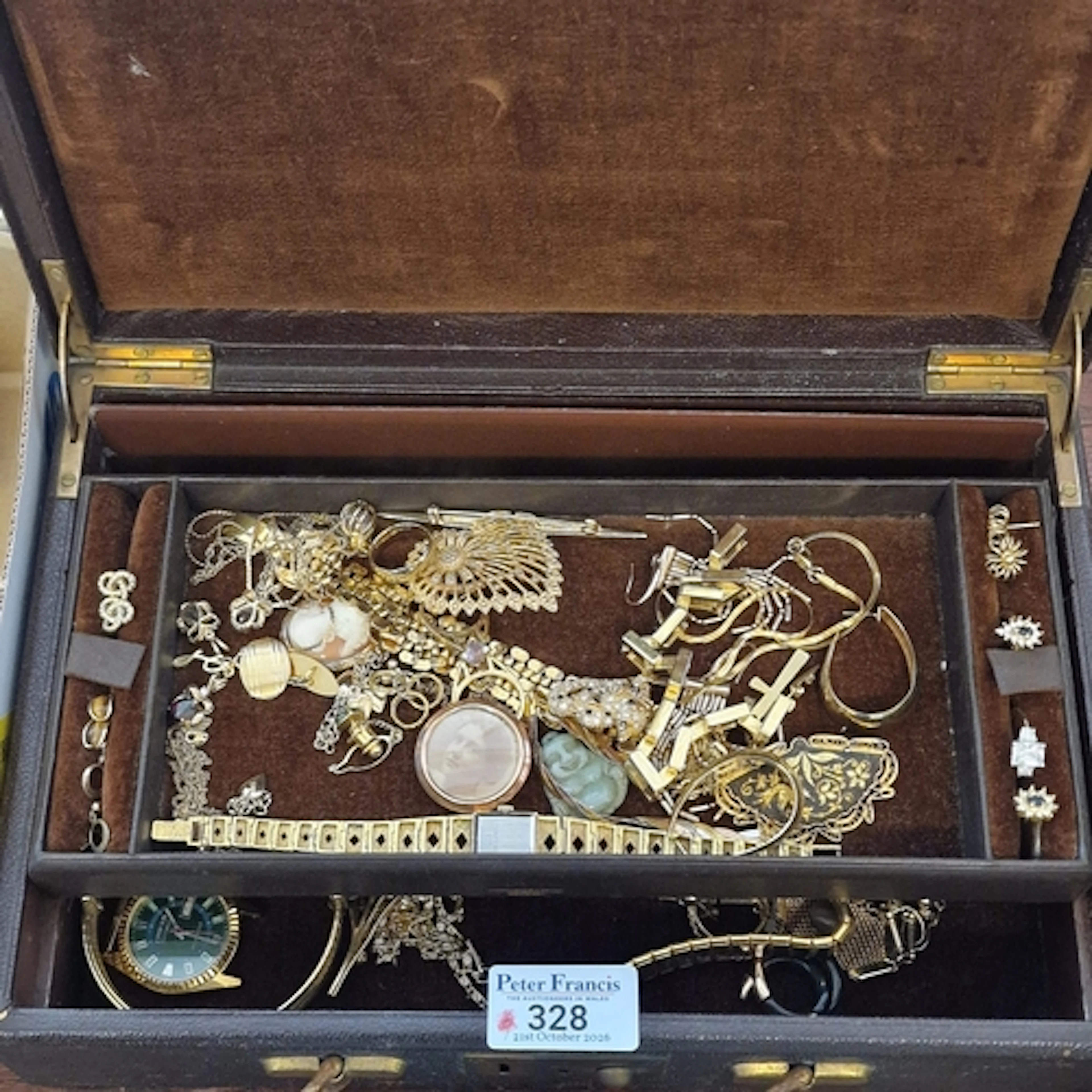 Early 20th century leather jewellery box comprising assorted...