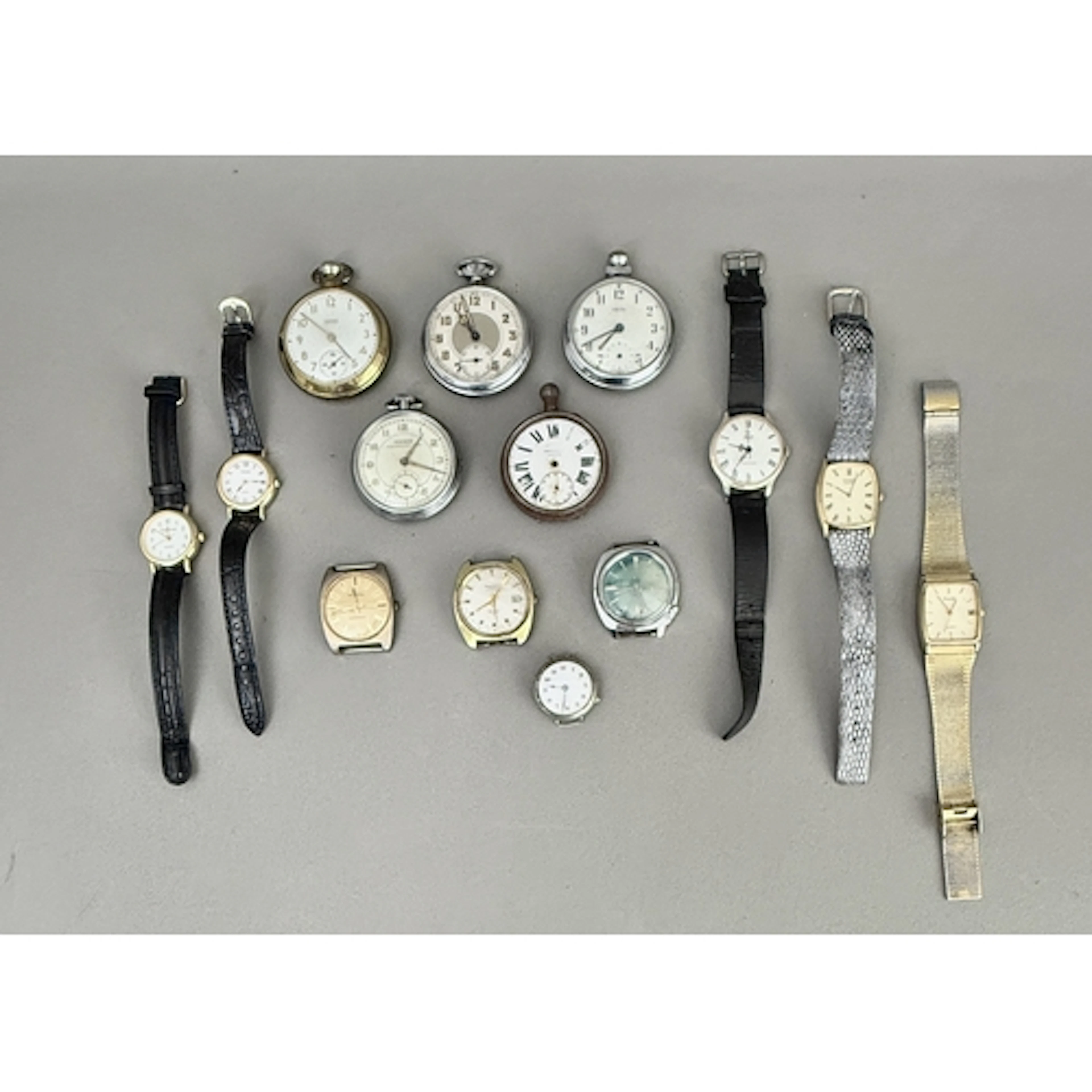 A group of vintage wrist and pocket watches - including a bo...
