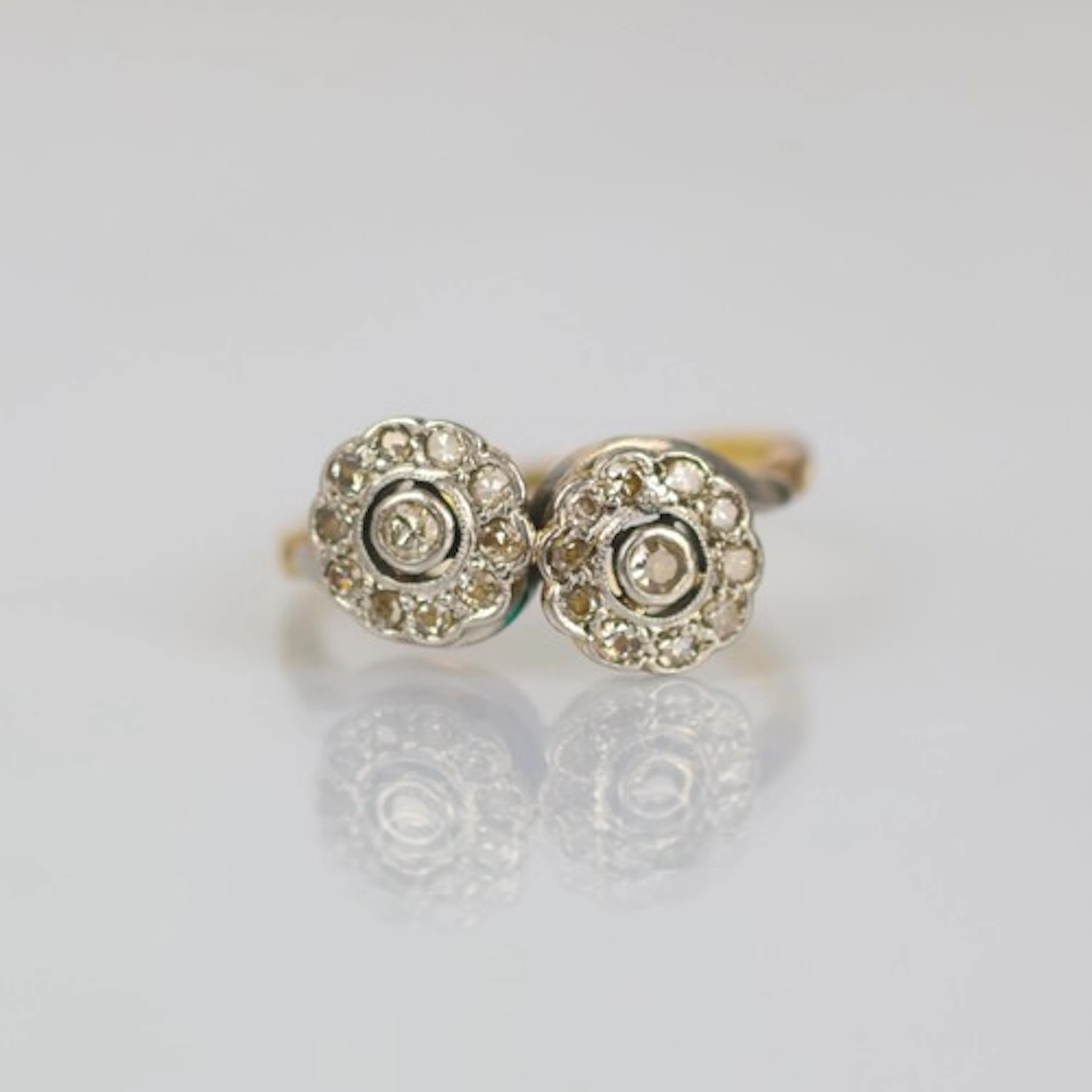 An early 20th double daisy cluster ring, the toi et moi styl...
