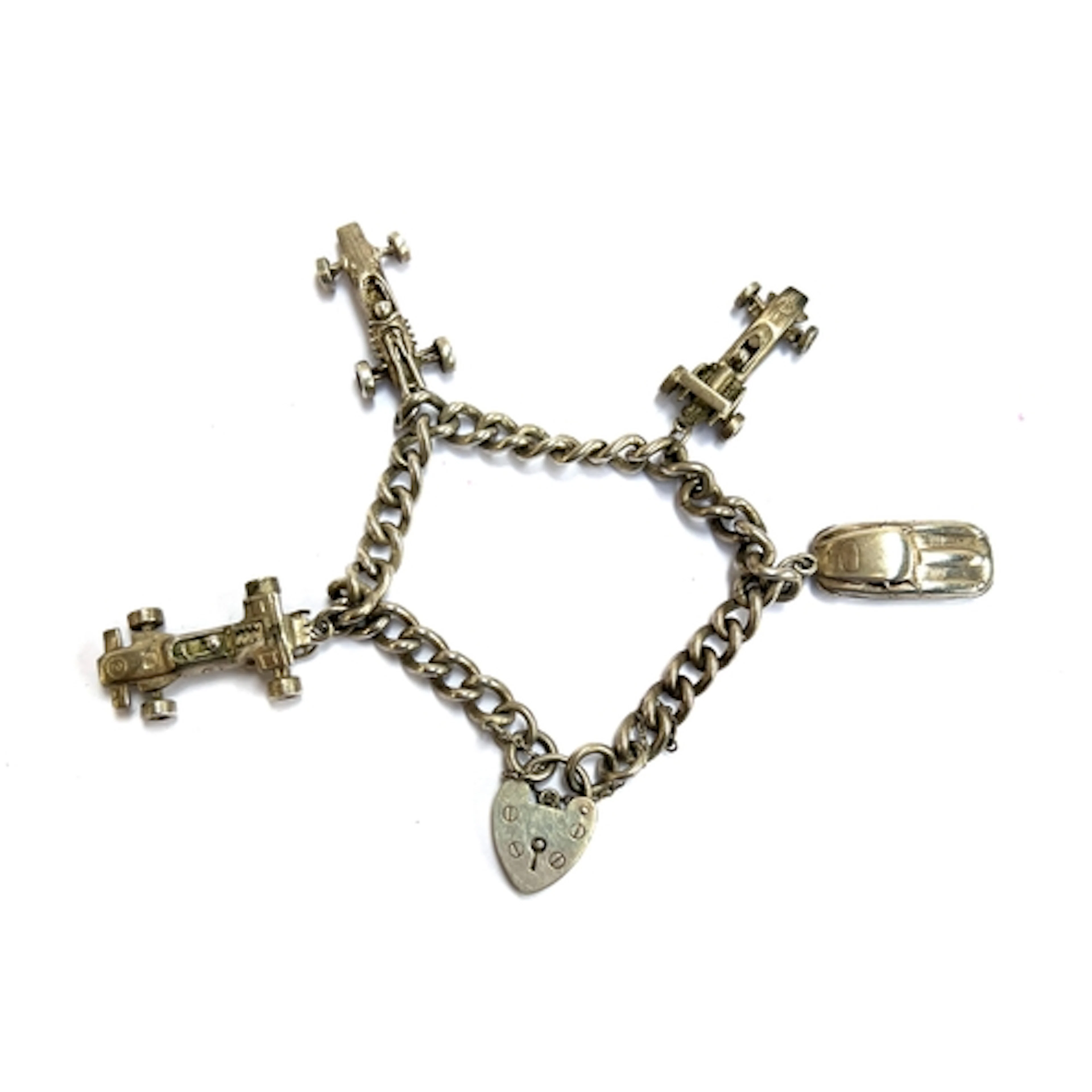 A silver charm bracelet with car related charms, one charm '...